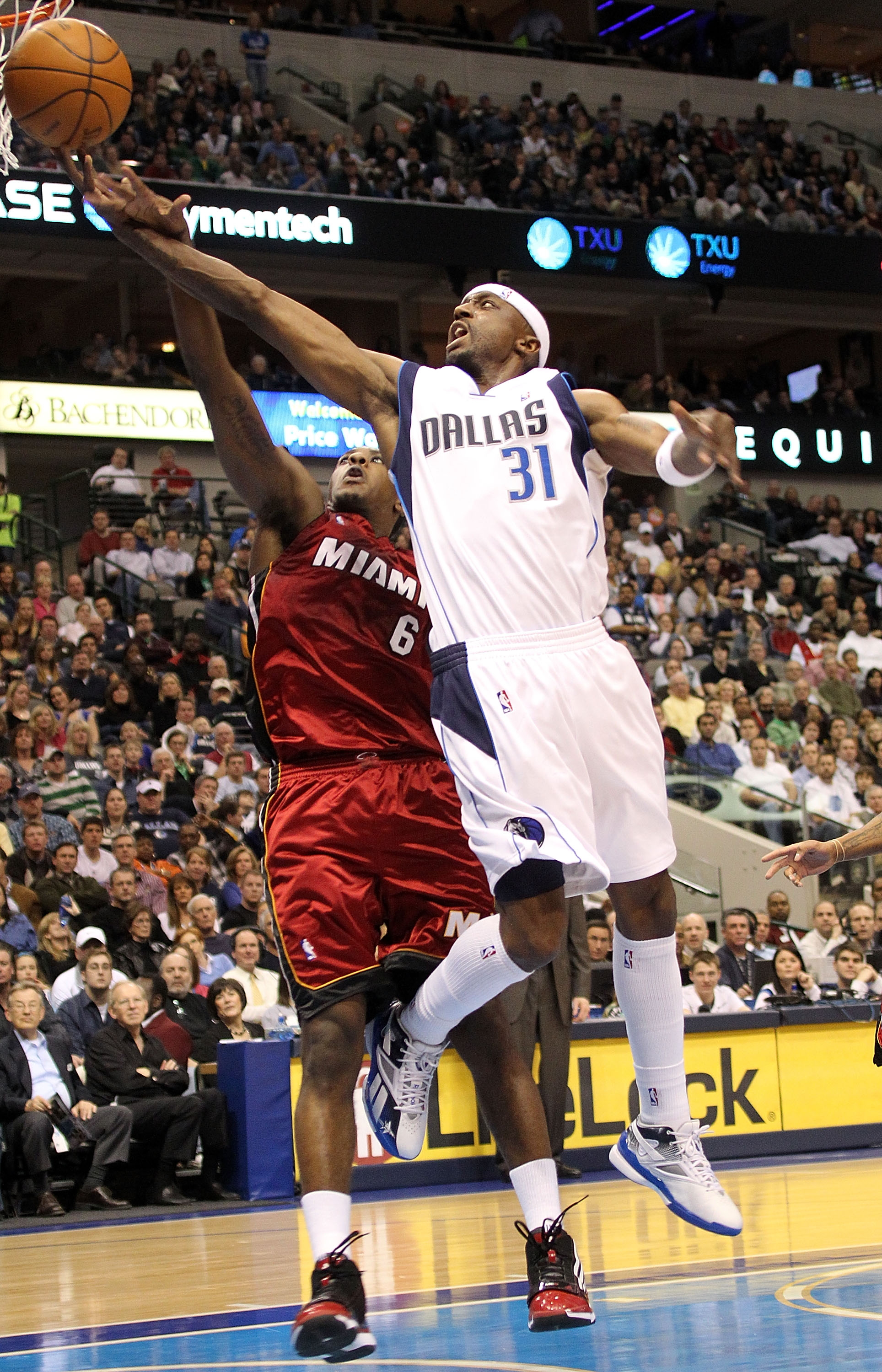 DALLAS - FEBRUARY 20:  Guard Jason Terry #31 of the Dallas Mavericks takes a shot against Mario Chalmers #6 of the Miami Heat on February 20, 2010 at American Airlines Center in Dallas, Texas.  NOTE TO USER: User expressly acknowledges and agrees that, by