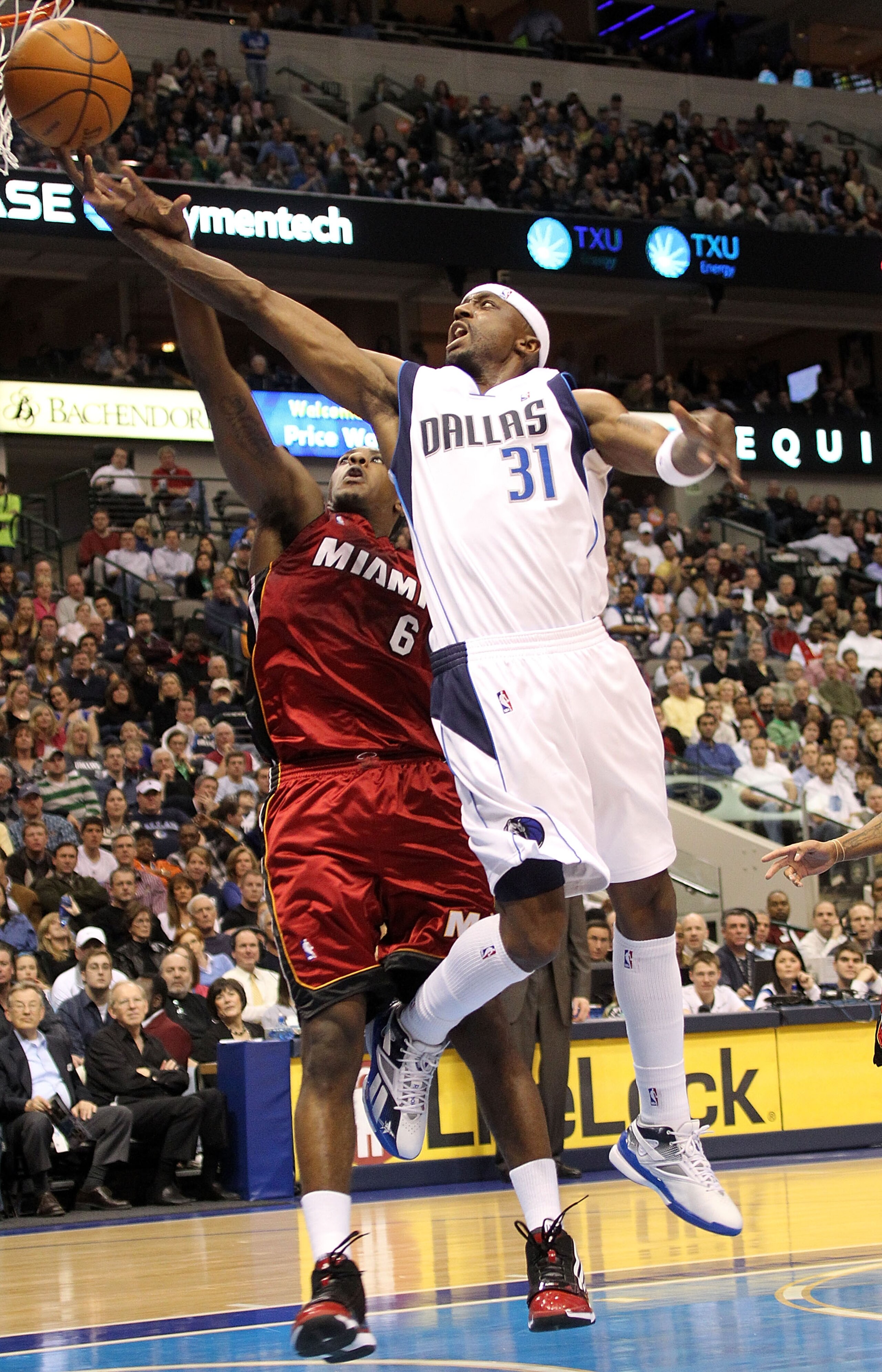 DALLAS - FEBRUARY 20:  Guard Jason Terry #31 of the Dallas Mavericks takes a shot against Mario Chalmers #6 of the Miami Heat on February 20, 2010 at American Airlines Center in Dallas, Texas.  NOTE TO USER: User expressly acknowledges and agrees that, by