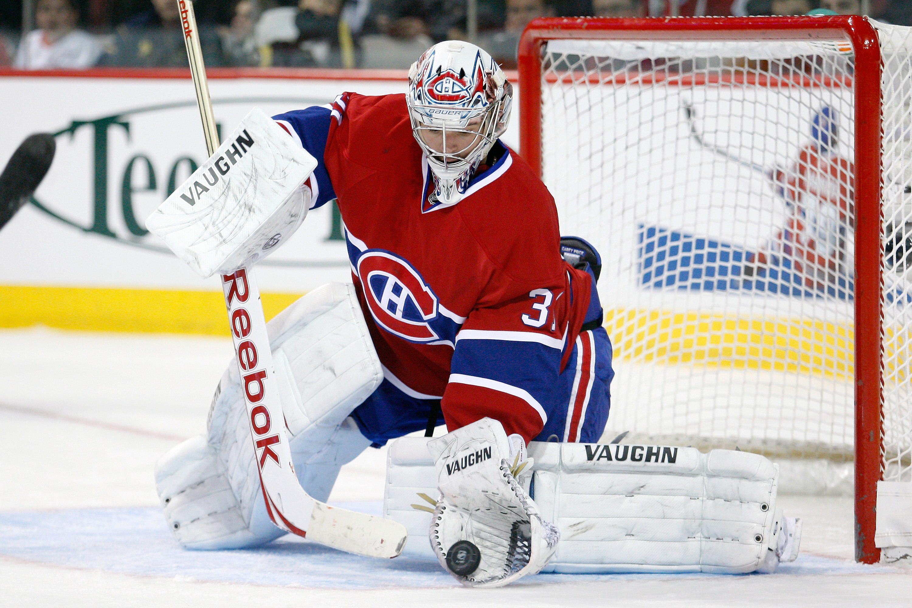 MONTREAL- NOVEMBER 13:  Carey Price #31 of the Montreal Canadiens makes a glove save on the puck during the NHL game against the Carolina Hurricanes at the Bell Centre on November 13, 2010 in Montreal, Quebec, Canada.  The Canadiens defeated the Hurricane