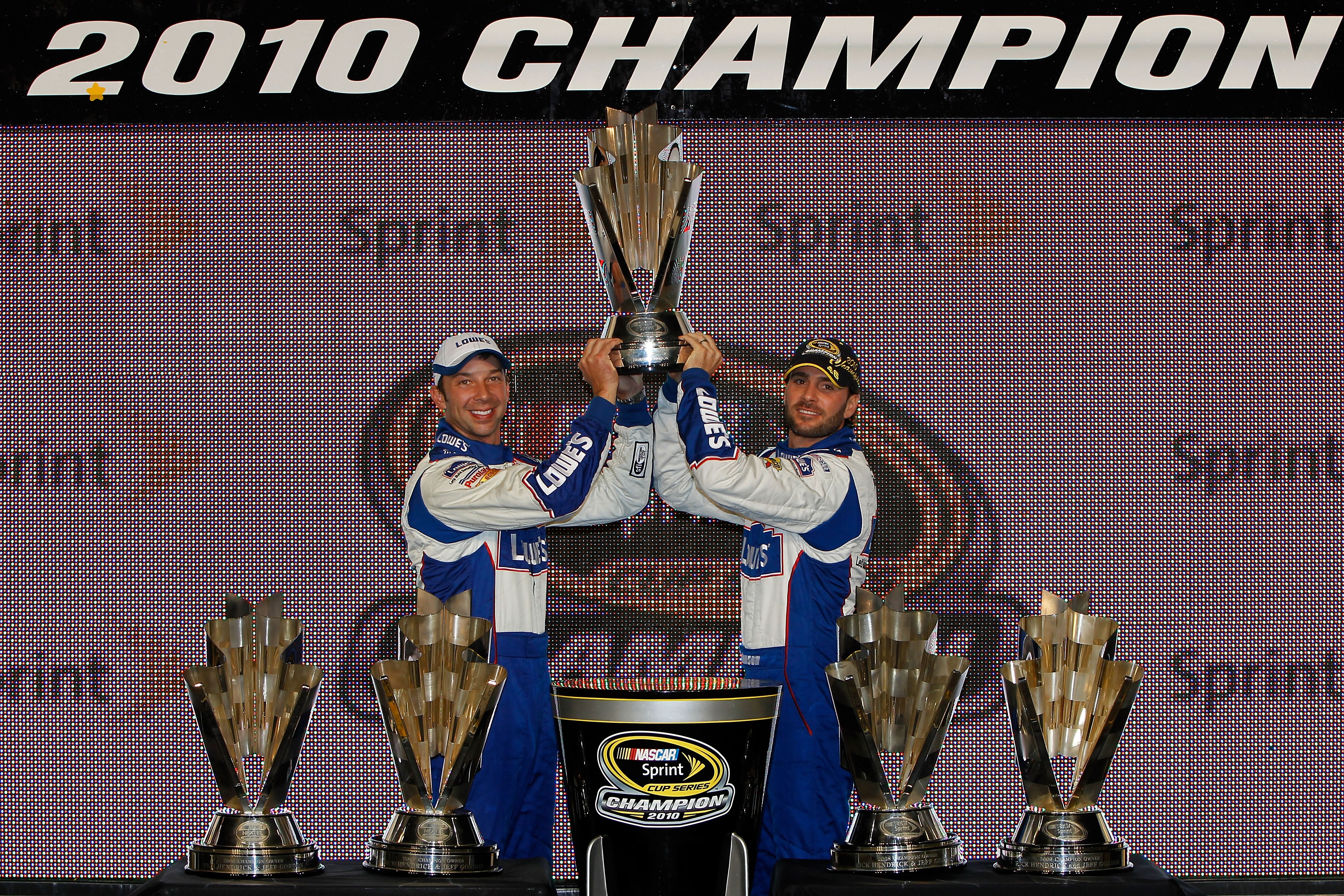 HOMESTEAD, FL - NOVEMBER 21:  (L-R) Crew chief Chad Knaus and Jimmie Johnson, driver of the #48 Lowe's Chevrolet, celebrate their fifth consecutive NASCAR Sprint Cup championship at Homestead-Miami Speedway on November 21, 2010 in Homestead, Florida.  (Ph