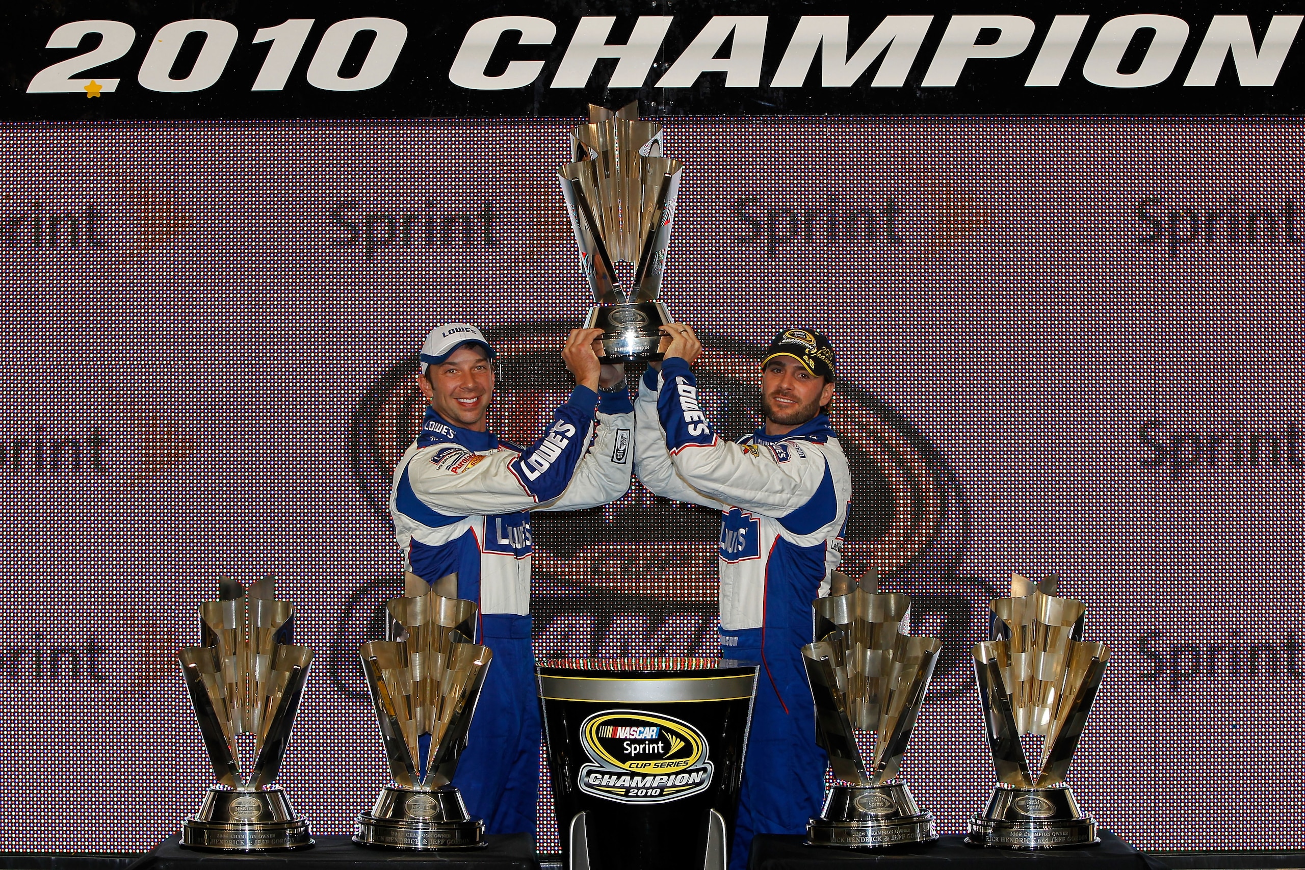 HOMESTEAD, FL - NOVEMBER 21:  (L-R) Crew chief Chad Knaus and Jimmie Johnson, driver of the #48 Lowe's Chevrolet, celebrate their fifth consecutive NASCAR Sprint Cup championship at Homestead-Miami Speedway on November 21, 2010 in Homestead, Florida.  (Ph