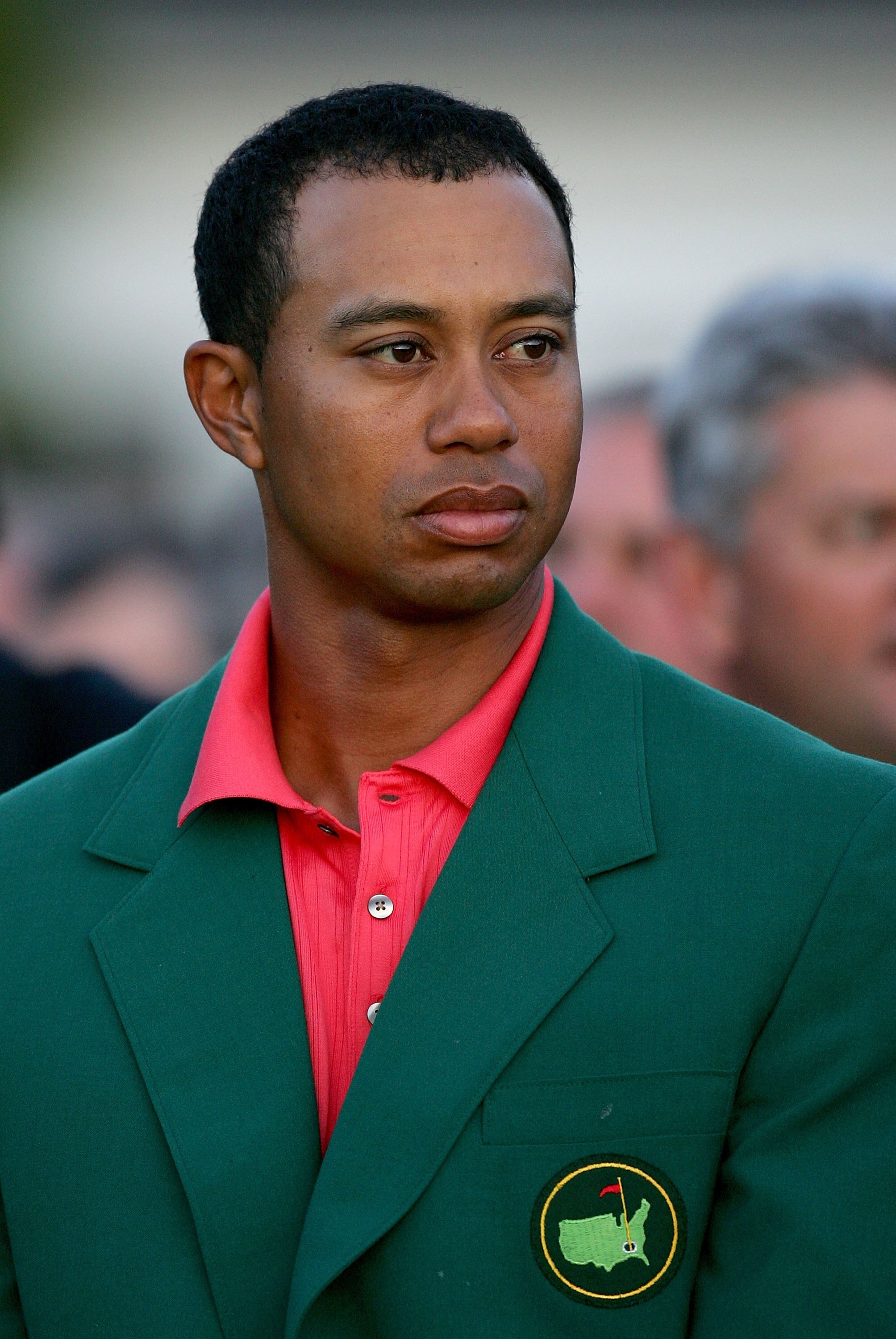 AUGUSTA, GA - APRIL 09:  Tiger Woods sits at the green jacket presentation before presenting Mickelson with the green jacket for winning The Masters at the Augusta National Golf Club after the final round on April 9, 2006 in Augusta, Georgia.  Mickelson w