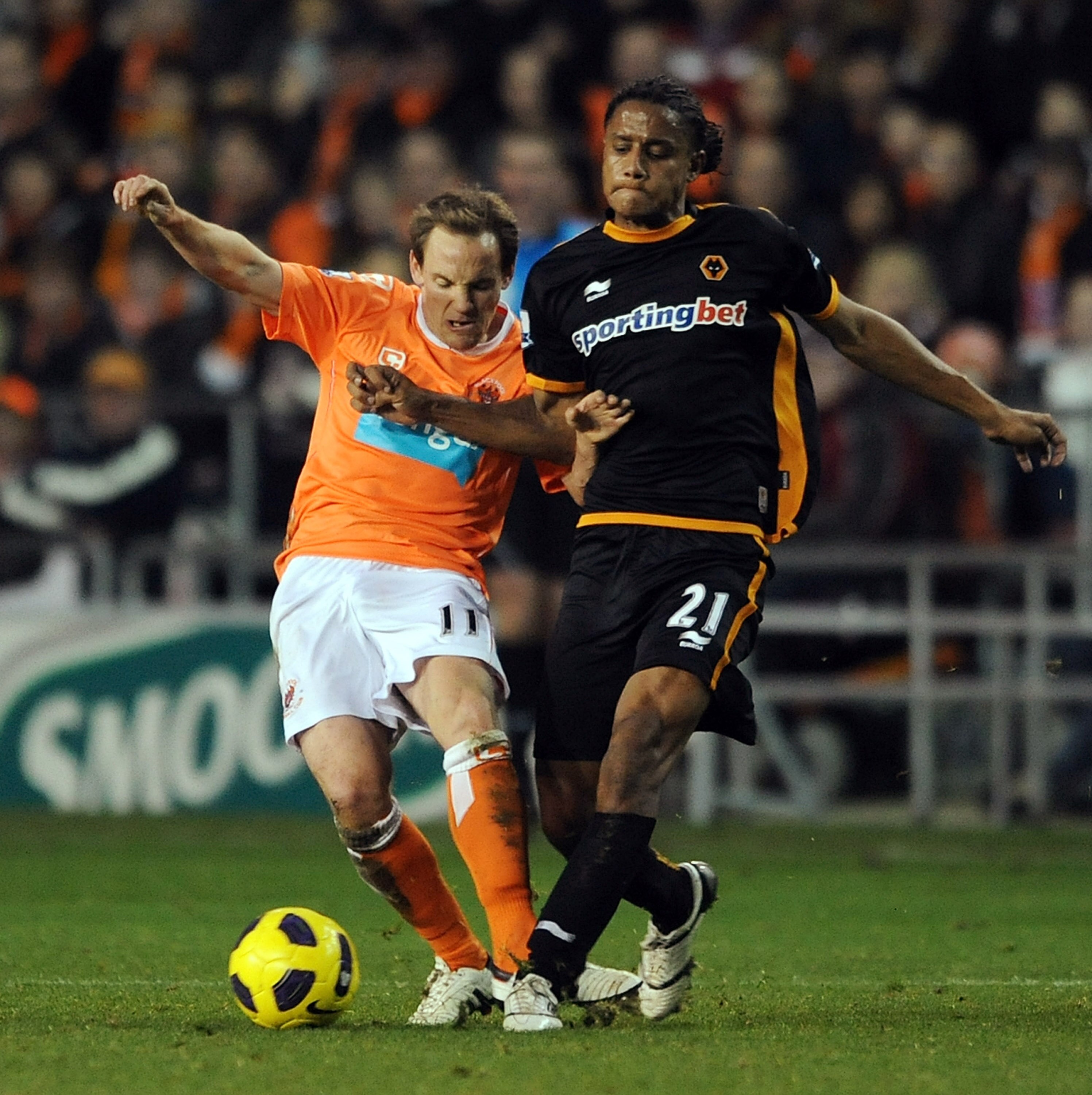 BLACKPOOL, ENGLAND - NOVEMBER 20:  David Vaughan of Blackpool competes with Michael Mancienne of Wolverhampton Wanderers during the Barclays Premier League match between Blackpool and Wolverhampton Wanderers at Bloomfield Road on November 20, 2010 in Blac