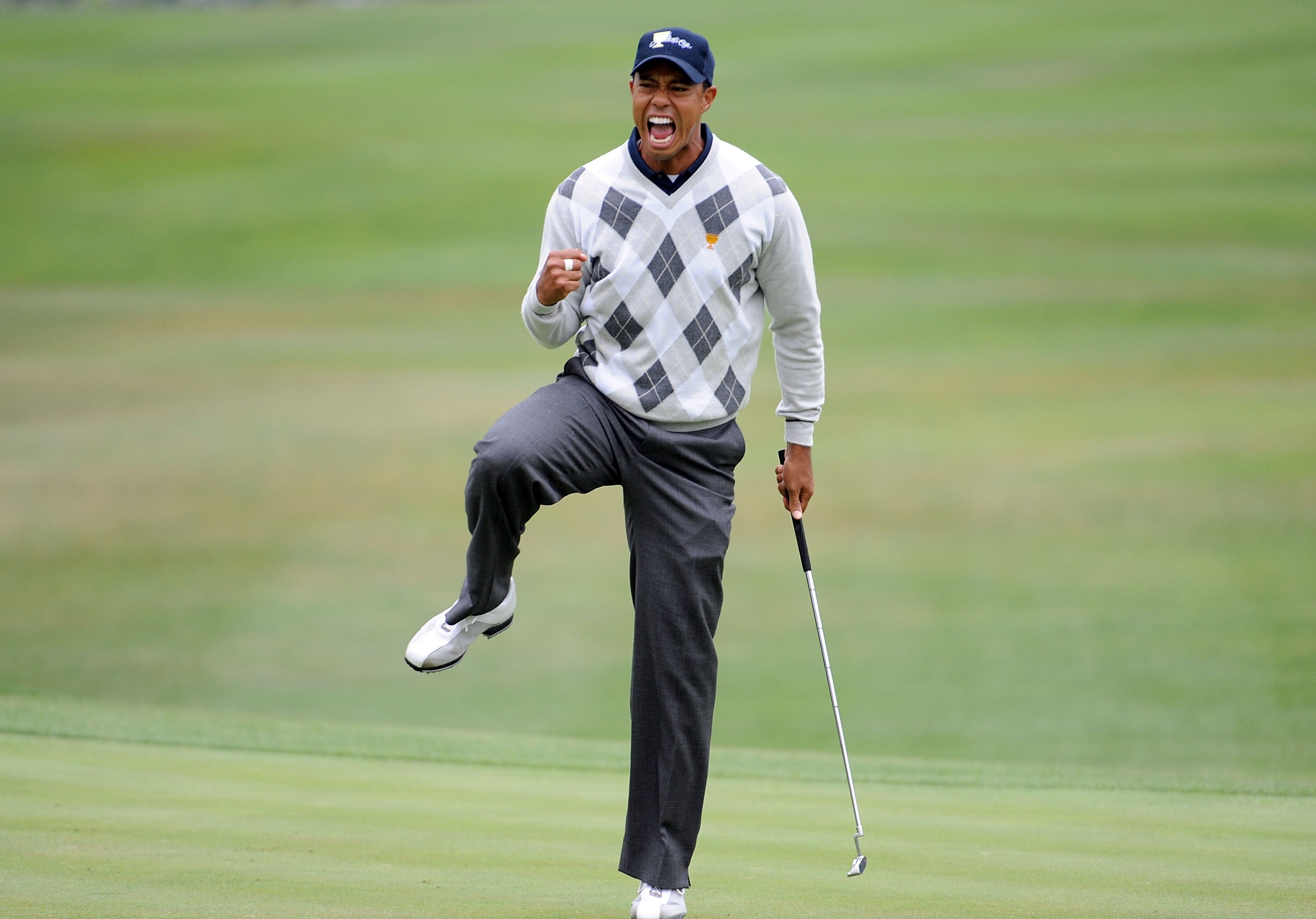 SAN FRANCISCO - OCTOBER 10:  Tiger Woods of the USA Team celebrates his putt for a birdie to win the 17th hole during the Day Three Morning Foursome Matches of The Presidents Cup at Harding Park Golf Course on October 10, 2009 in San Francisco, California