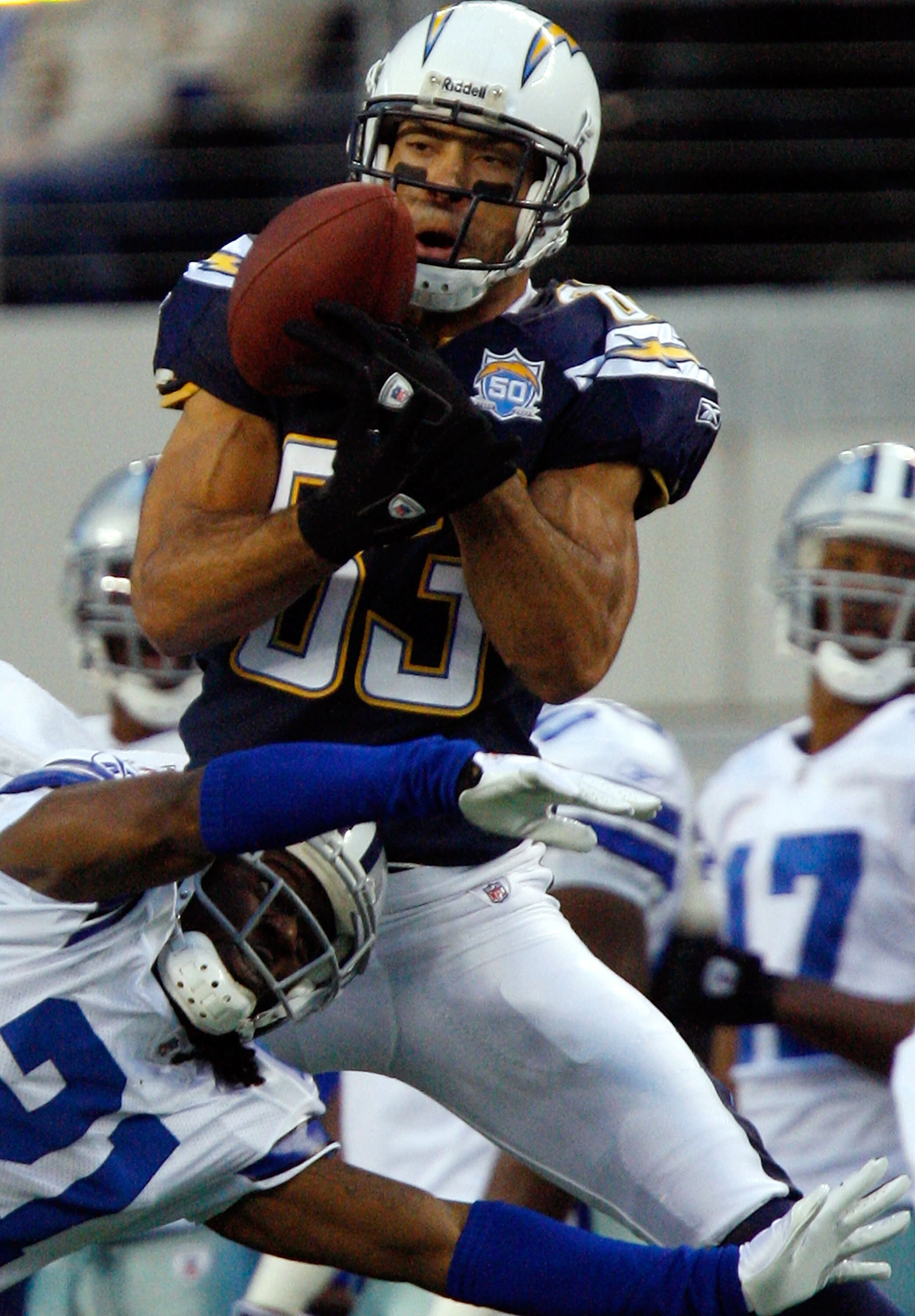 ARLINGTON, TX - DECEMBER 13:  Wide receiver Vincent Jackson #83 of the San Diego Chargers makes a pass reception against Mike Jenkins #21 of the Dallas Cowboys at Cowboys Stadium on December 13, 2009 in Arlington, Texas.  (Photo by Ronald Martinez/Getty I
