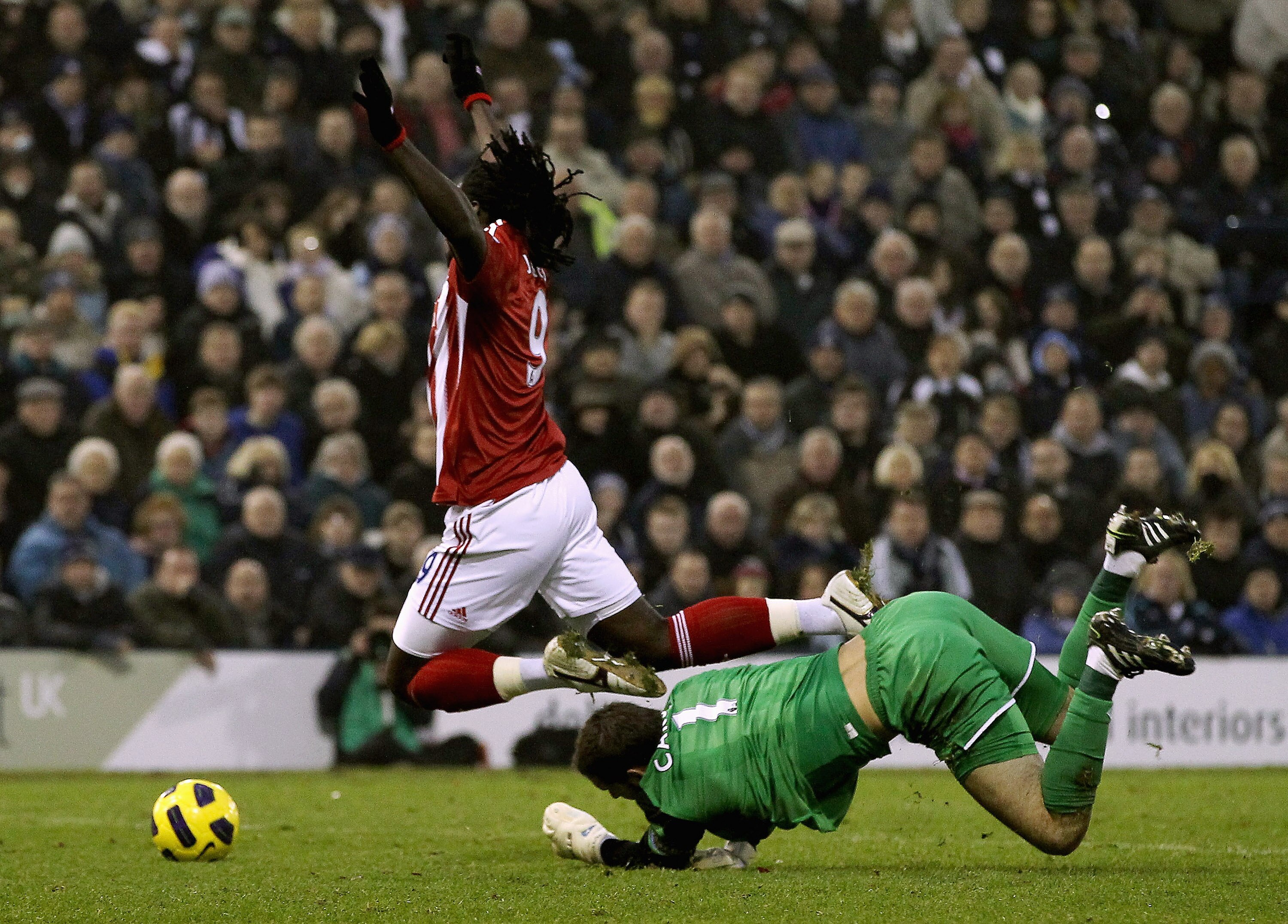 WEST BROMWICH, ENGLAND - NOVEMBER 20:  Scott Carson of West Brom (R) brings down Kenwyne Jones of Stoke to concede a penalty during the Barclays Premier League match between West Bromwich Albion and Stoke City at The Hawthorns on November 20, 2010 in West