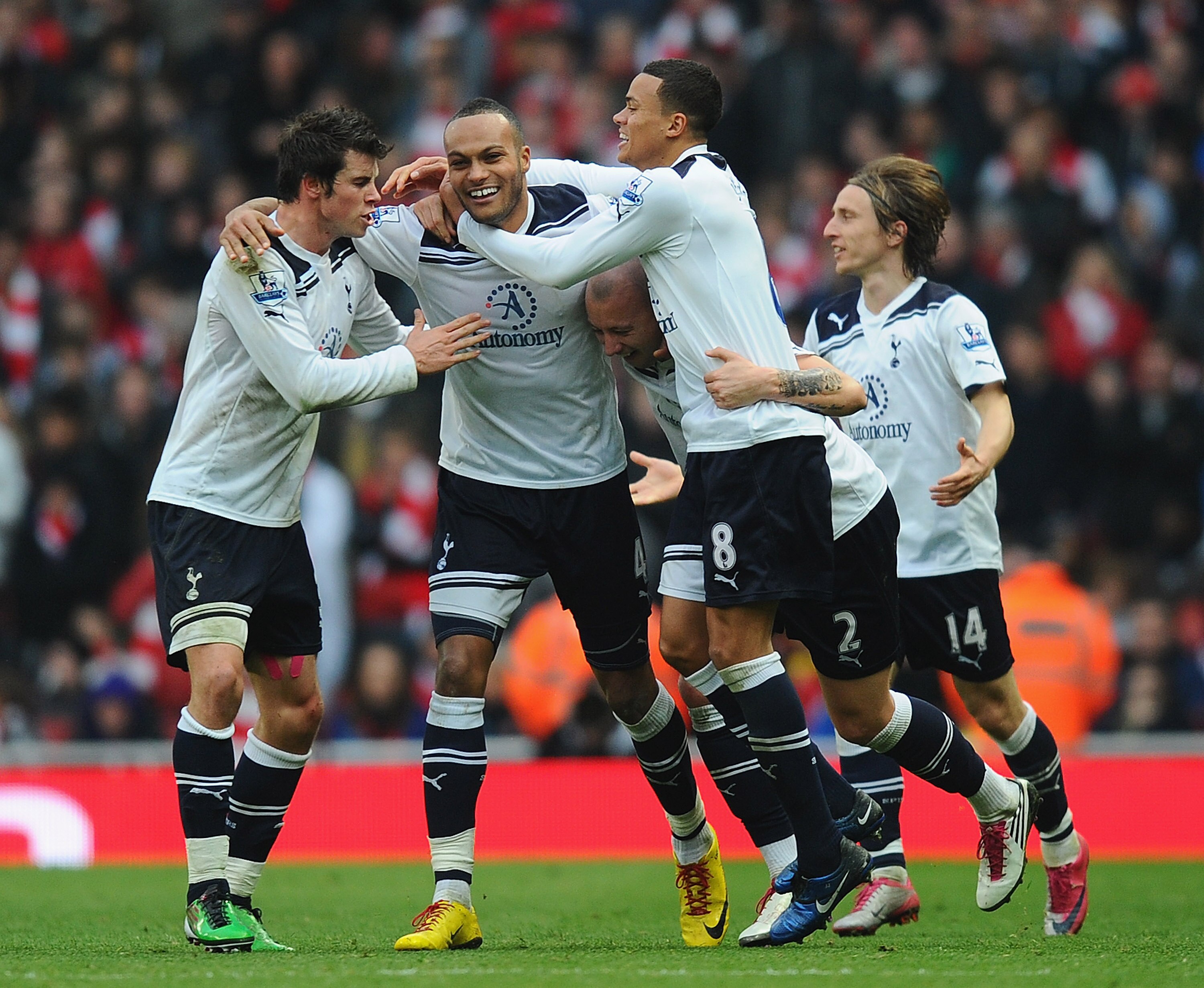 LONDON, ENGLAND - NOVEMBER 20:  Younes Kaboul of Tottenham celebrates with team mates Gareth Bale, Alan Hutton and Jermaine Jenas after scoring the winner during the Barclays Premier League match between Arsenal and Tottenham Hotspur at the Emirates Stadi