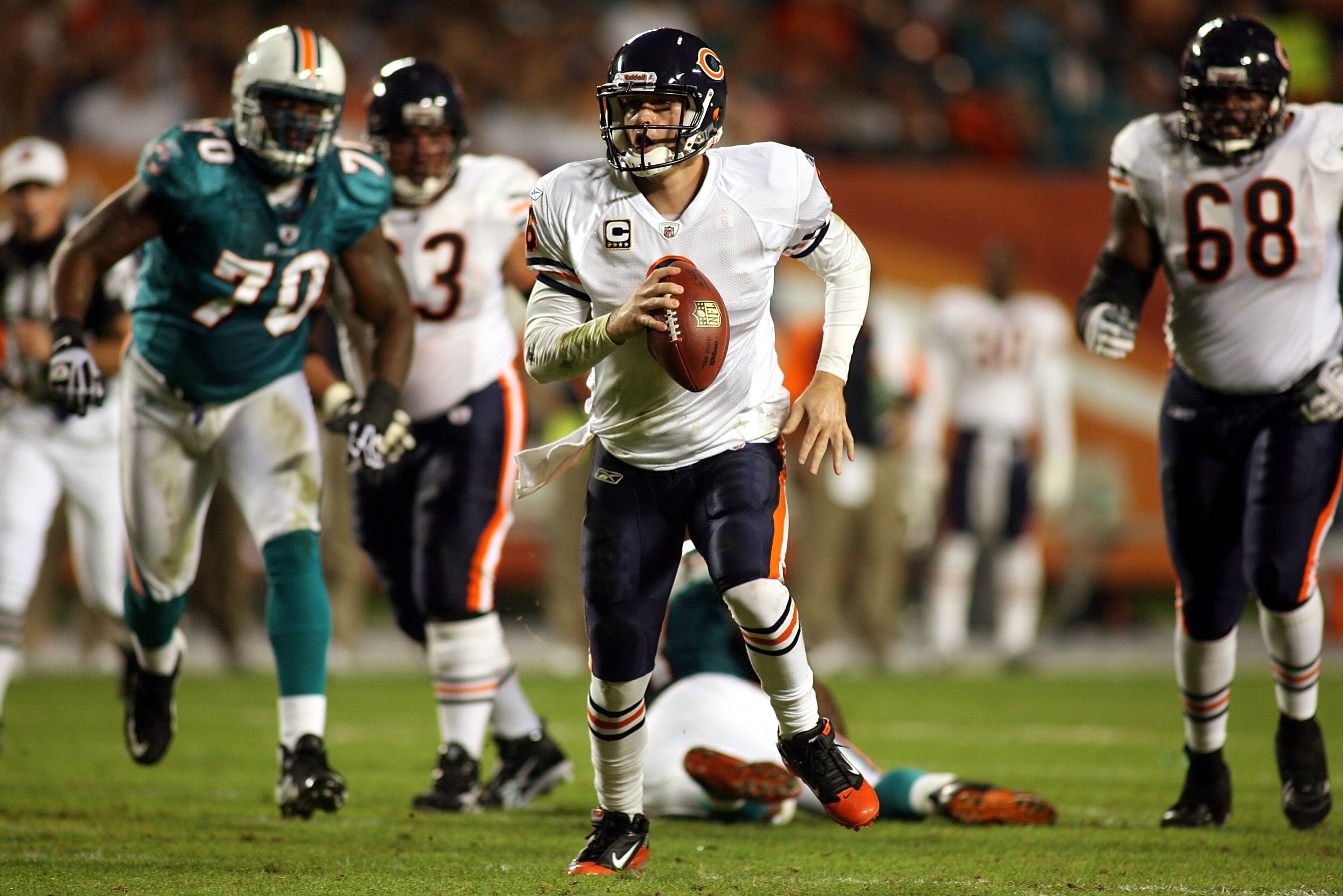 MIAMI - NOVEMBER 18:  Quarterback Jay Cutler #6 of the Chicago Bears scrambles against the Miami Dolphins at Sun Life Stadium on November 18, 2010 in Miami, Florida.  (Photo by Marc Serota/Getty Images)