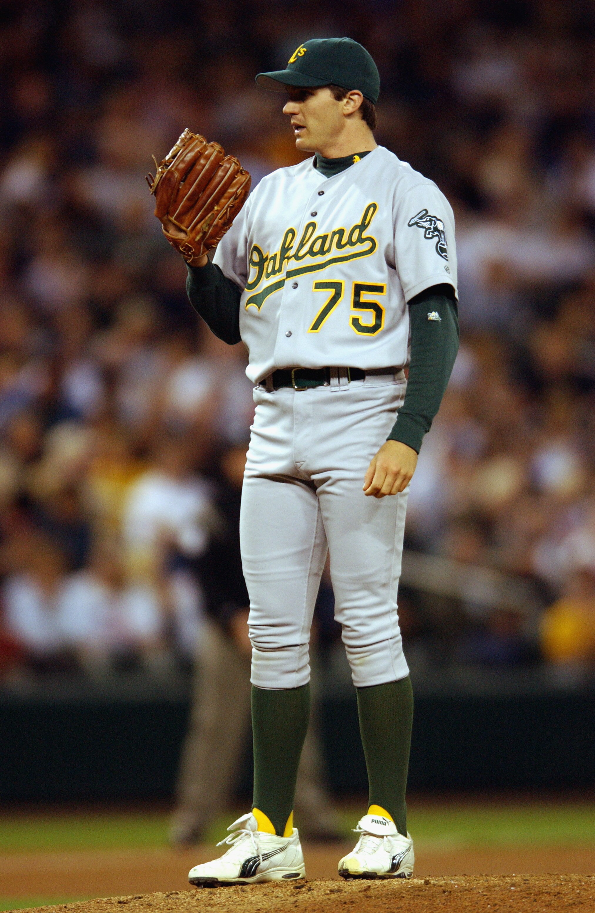 SEATTLE - SEPTEMBER 24:  Pitcher Barry Zito #75 of the Oakland Athletics looks in for the sign during the MLB game against the Seattle Mariners on September 24, 2002 at Safeco Field in Seattle, Washington. The Mariners won 8-7. (Photo by Otto Greule Jr/Ge