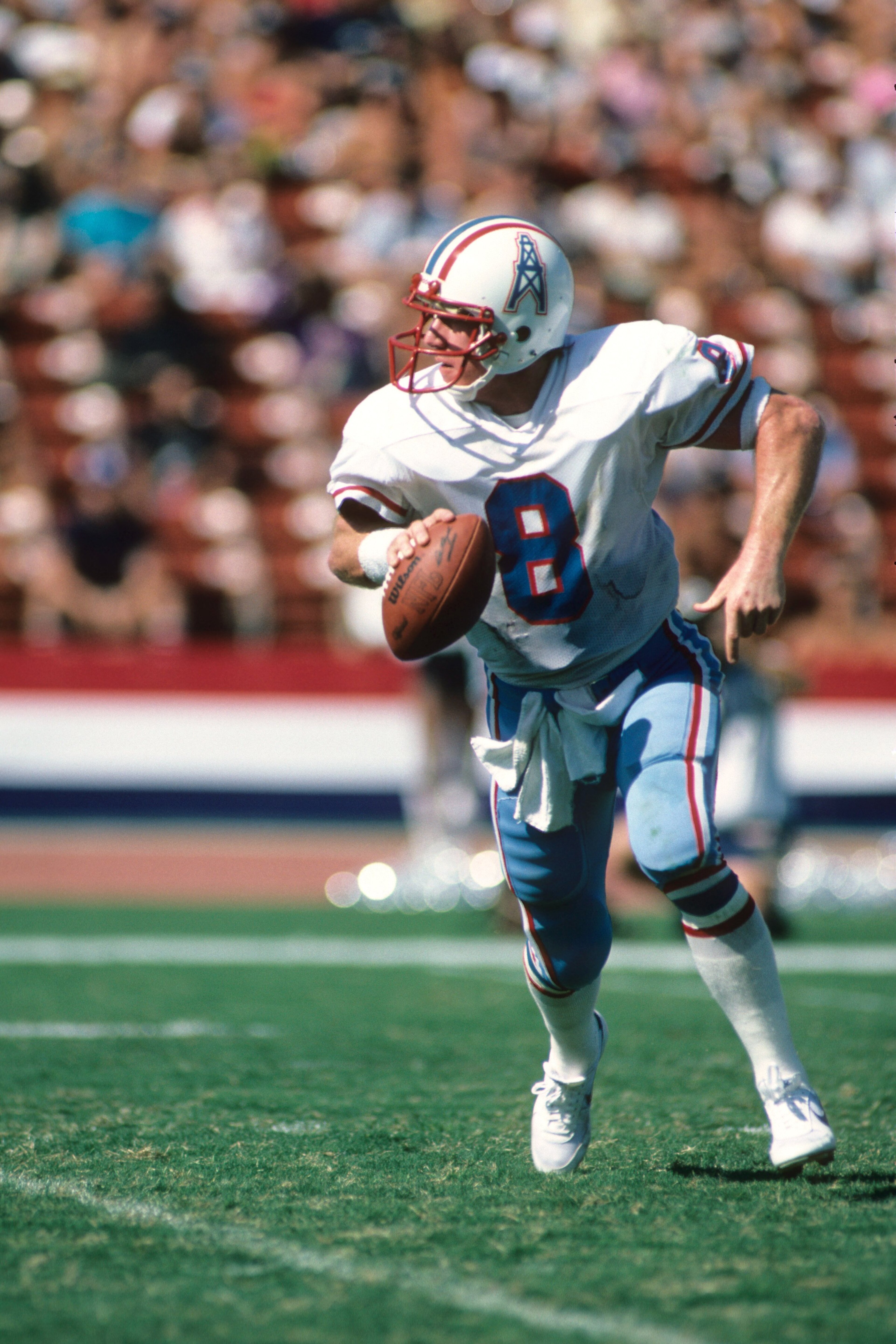 LOS ANGELES - NOVEMBER 11: Quaterback Archie Manning #8 of the Houston Oilers rolls out to pass during the game against the Los Angeles Raiders at the Los Angeles Memorial Coliseum on November 11, 1983 in Los Angeles, California. The Raiders won 20-6. LOS ANGELES - NOVEMBER 11: Quaterback Archie Manning #8 of the Houston Oilers rolls out to pass during the game against the Los Angeles Raiders at the Los Angeles Memorial Coliseum on November 11, 1983 in Los Angeles, California. The Raiders won 20-6.