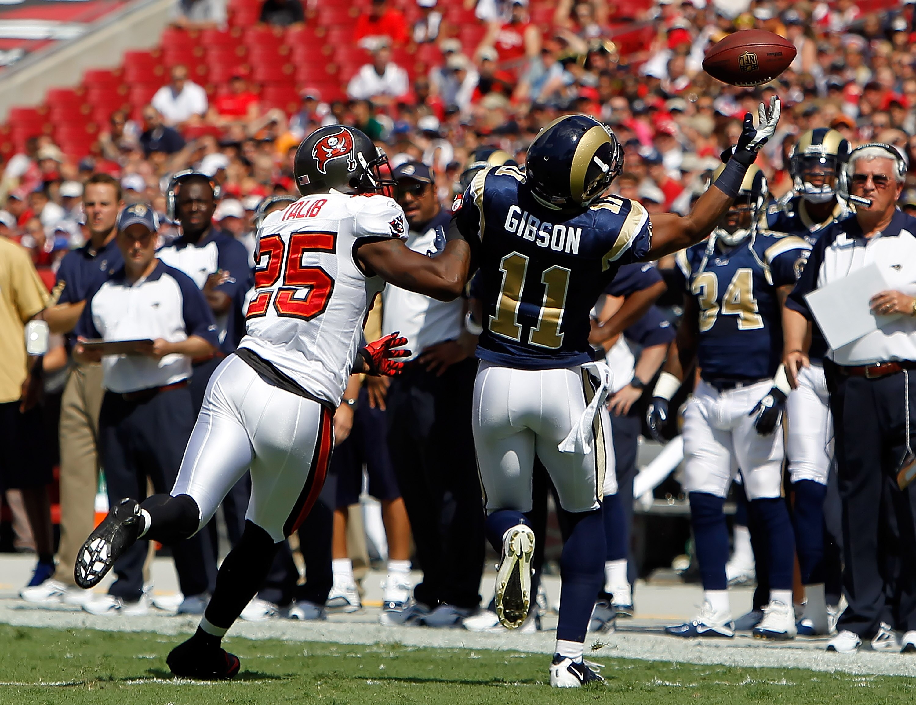 TAMPA, FL - OCTOBER 24:  Cornerback Aqib Talib #25 of the Tampa Bay Buccaneers breaks up this pass intended for receiver Brandon Gibson #11 of the St. Louis Rams during the game at Raymond James Stadium on October 24, 2010 in Tampa, Florida.  (Photo by J.