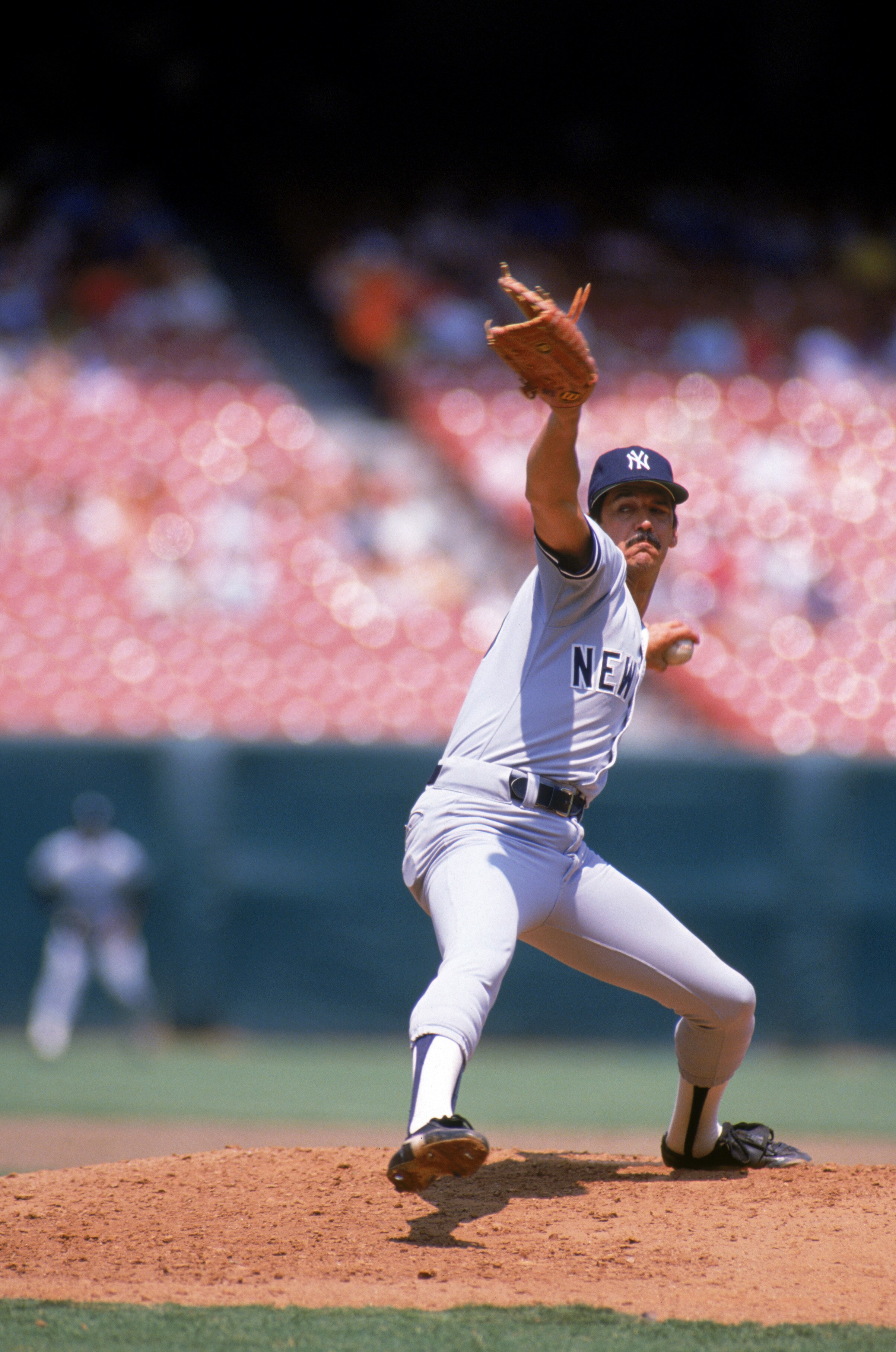 ANAHEIM, CA - 1987:  Ron Guidry #49 of the New York Yankees pitches during a game in the 1987 season against the California Angels at Anaheim Stadium in Anaheim, California.  (Photo by Tim DeFrisco/Getty Images)
