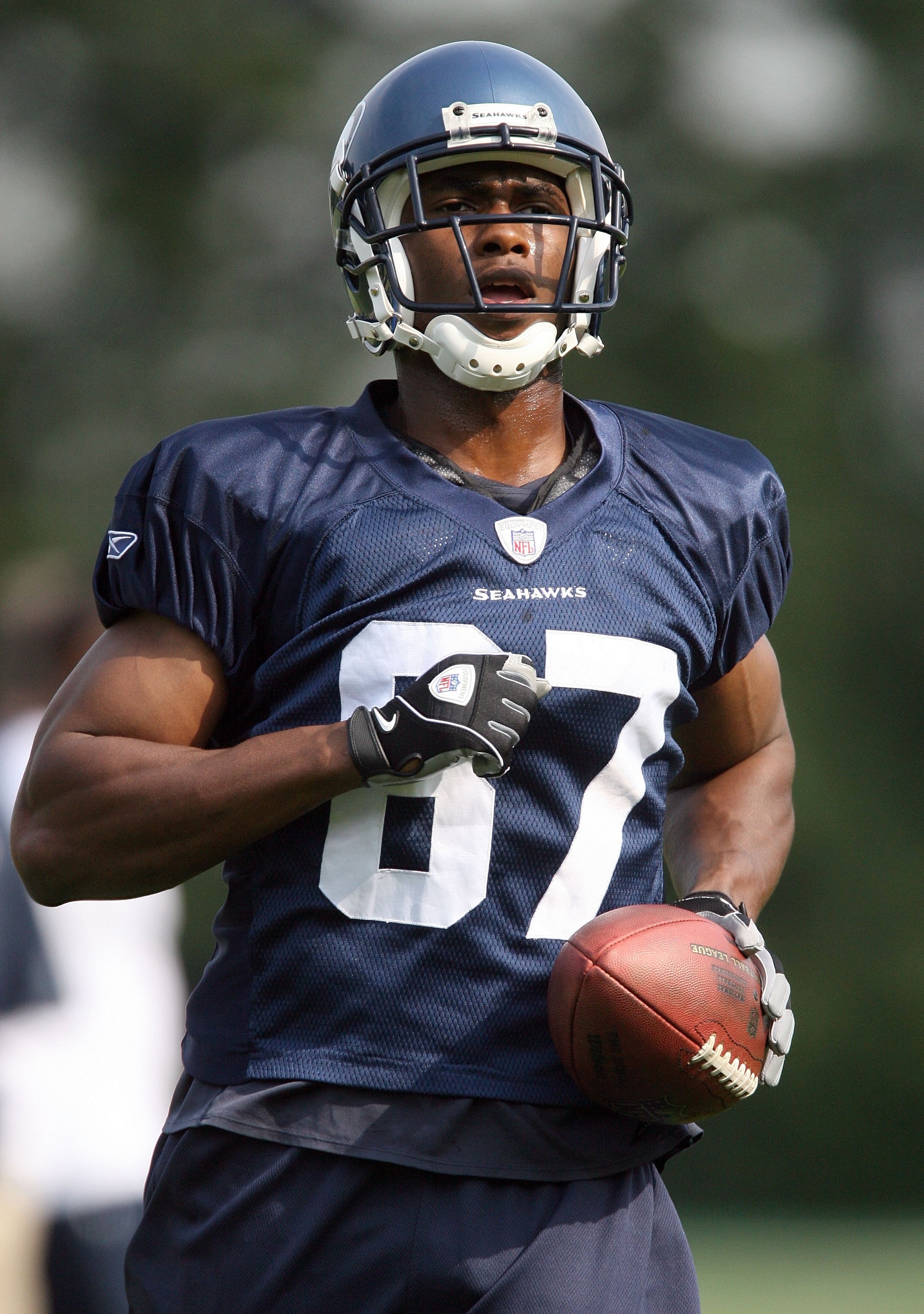 KIRKLAND, WA - JULY 25:  Ben Obamanu #87 of the Seattle Seahawks jogs with the ball during training camp at the Seahawks Training Facility on July 25, 2008 in Kirkland, Washington. (Photo by Otto Greule Jr/Getty Images)
