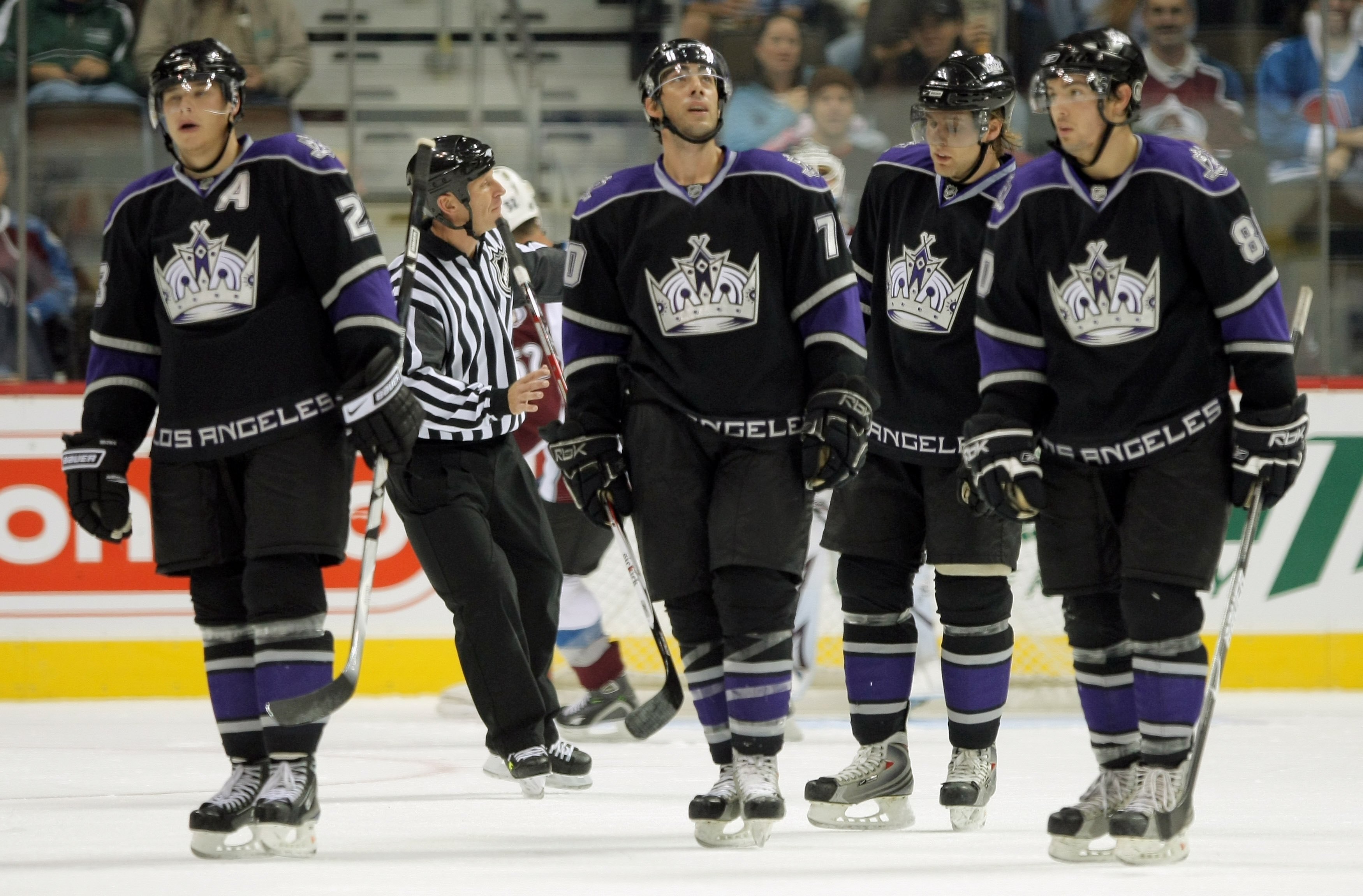 DENVER - SEPTEMBER 24:  Dustin Brown #23, Matt Moulson #70, Jack Johnson #3 and Drew Doughty #80 of the Los Angeles Kings head toward the bench after scoring against the Colorado Avalanche during NHL preseason action at the Pepsi Center on September 24, 2