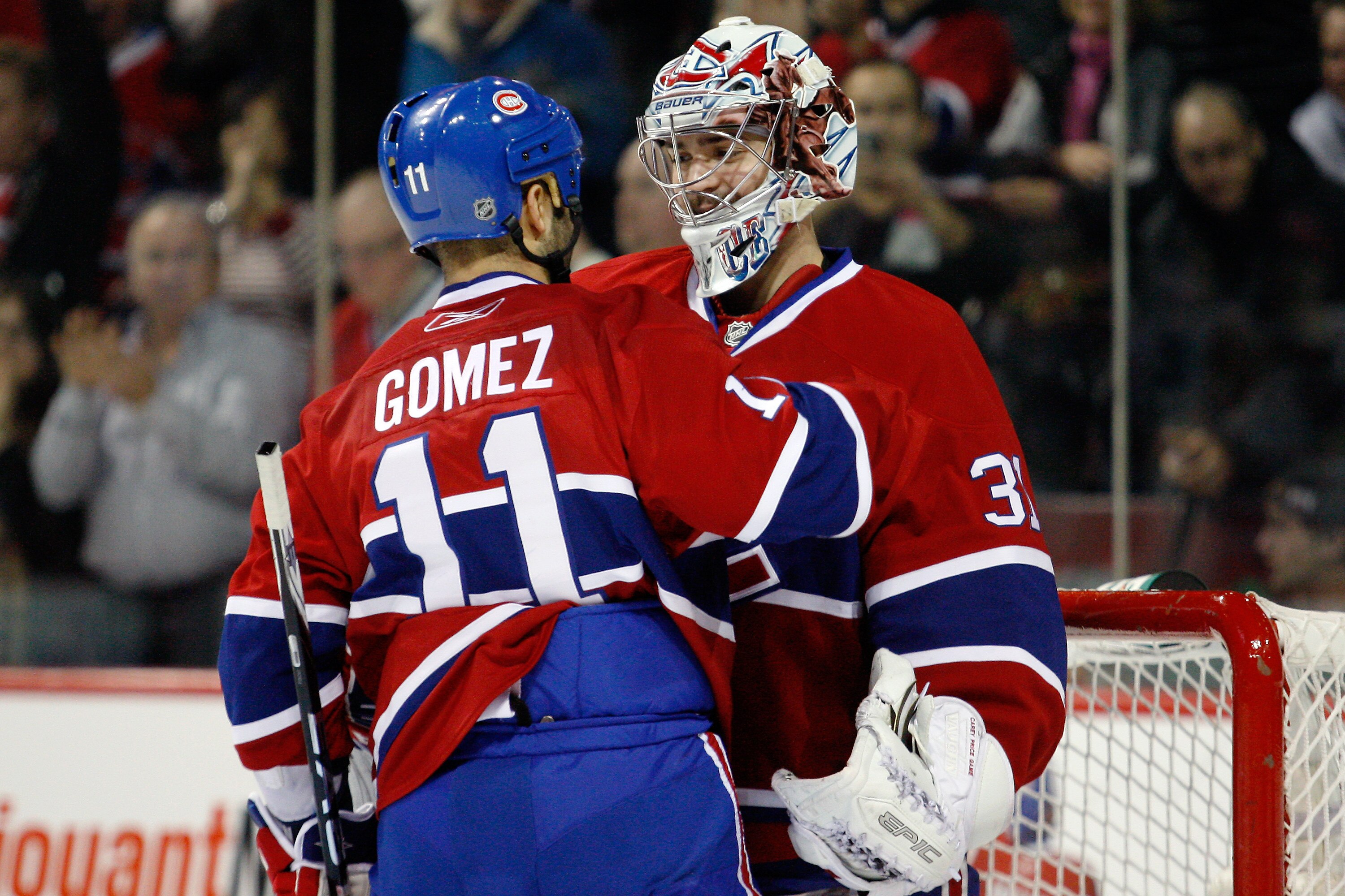MONTREAL - NOVEMBER 20:  Scott Gomez #11 of the Montreal Canadiens congratulates teammate goalie Carey Price #31 on his shutout victory over the Toronto Maple Leafs during the NHL game at the Bell Centre on November 20, 2010 in Montreal, Quebec, Canada.