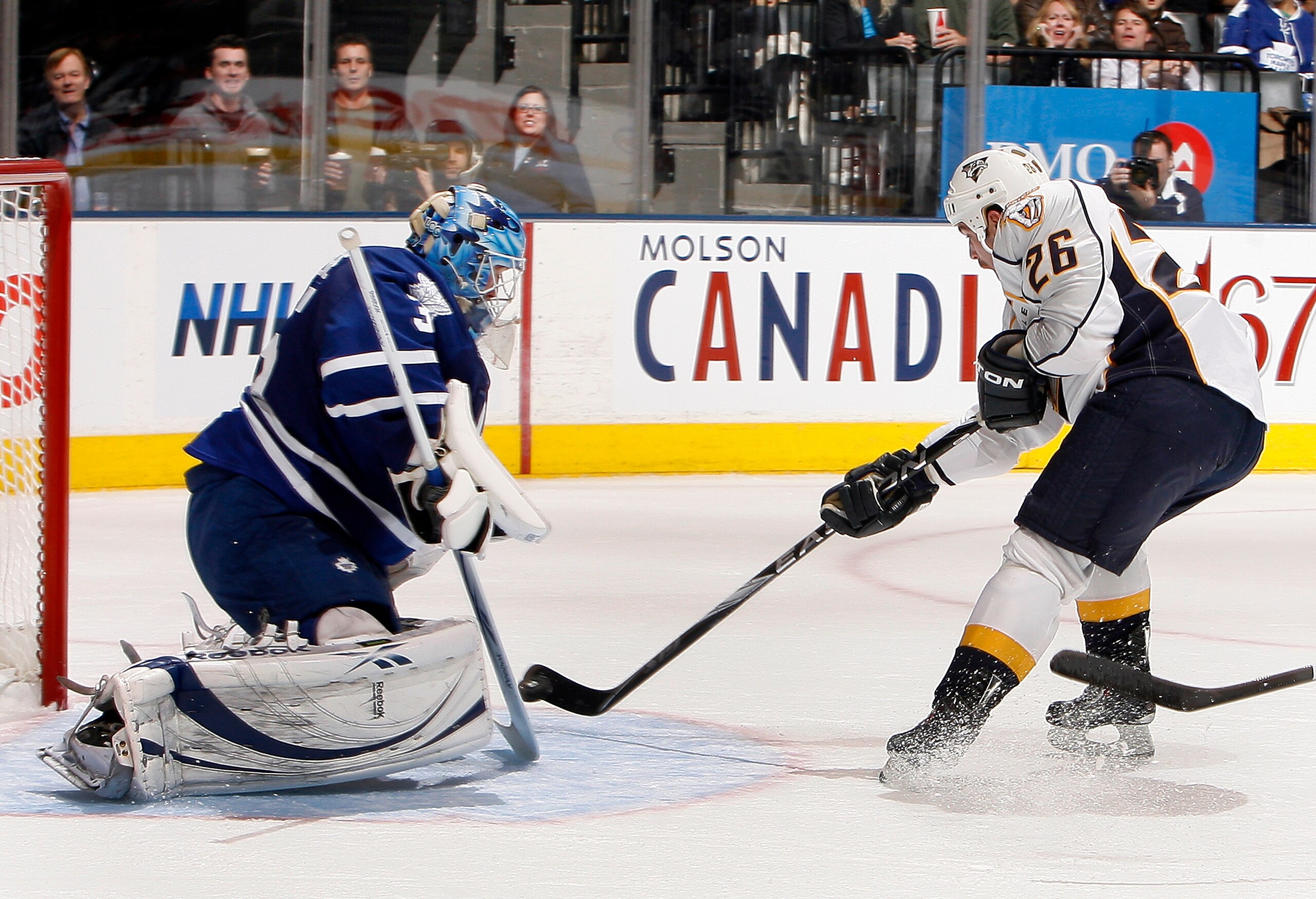 TORONTO - NOVEMBER 16: Jean-Sebastien Giguere #35 of the Toronto Maple Leafs makes a save on Steve Sullivan #26 of the Nashville Predators during game action at the Air Canada Centre November 16, 2010 in Toronto, Ontario, Canada. (Photo by Abelimages/Gett TORONTO - NOVEMBER 16: Jean-Sebastien Giguere #35 of the Toronto Maple Leafs makes a save on Steve Sullivan #26 of the Nashville Predators during game action at the Air Canada Centre November 16, 2010 in Toronto, Ontario, Canada. (Photo by Abelimages/Gett
