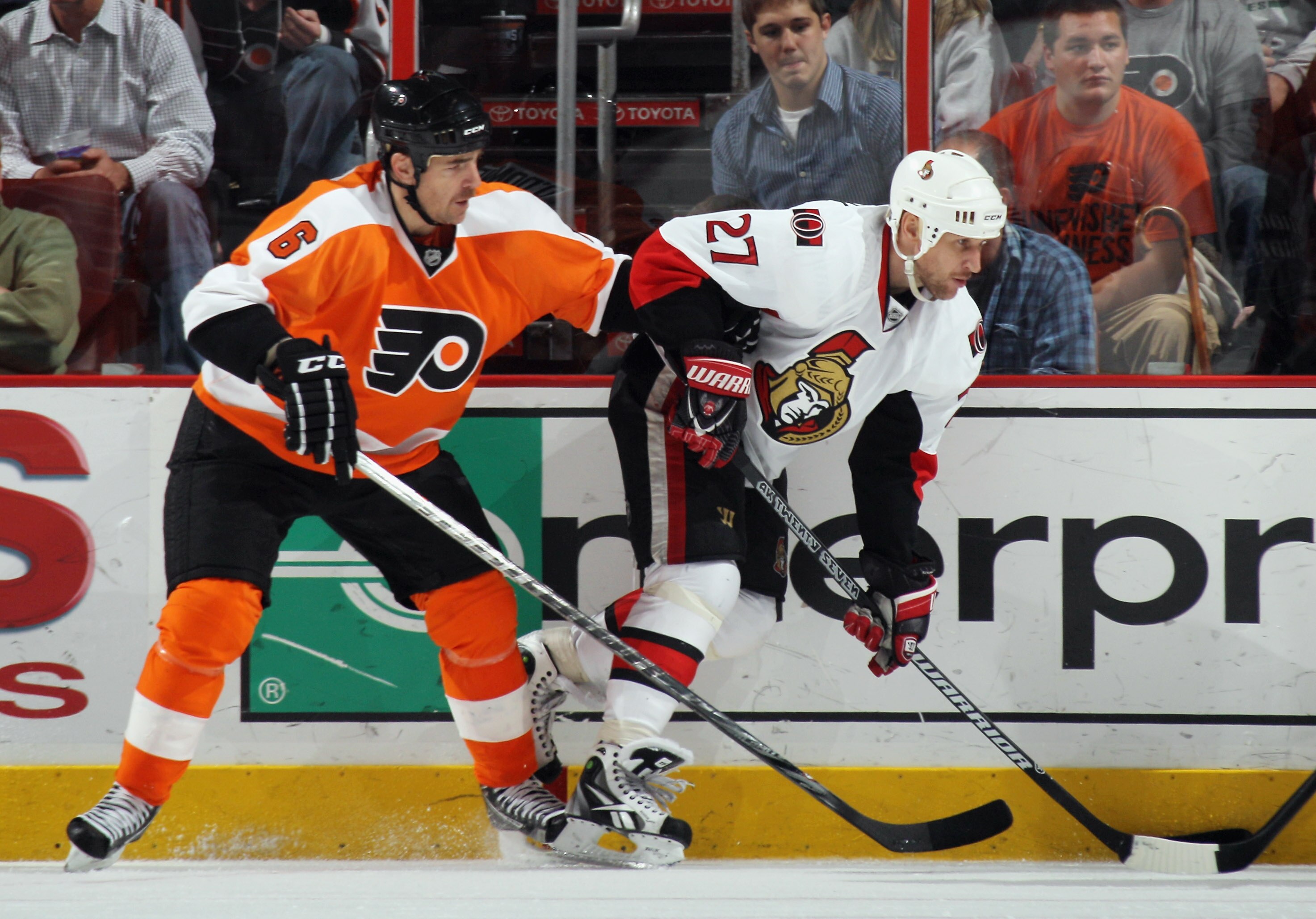PHILADELPHIA - NOVEMBER 15: Alex Kovalev #27 of the Ottawa Senators is checked by Sean O'Donnell #6 of the Philadelphia Flyers at the Wells Fargo Center on November 15, 2010 in Philadelphia, Pennsylvania. The Flyers defeated the Senators 5-1. (Photo by Br