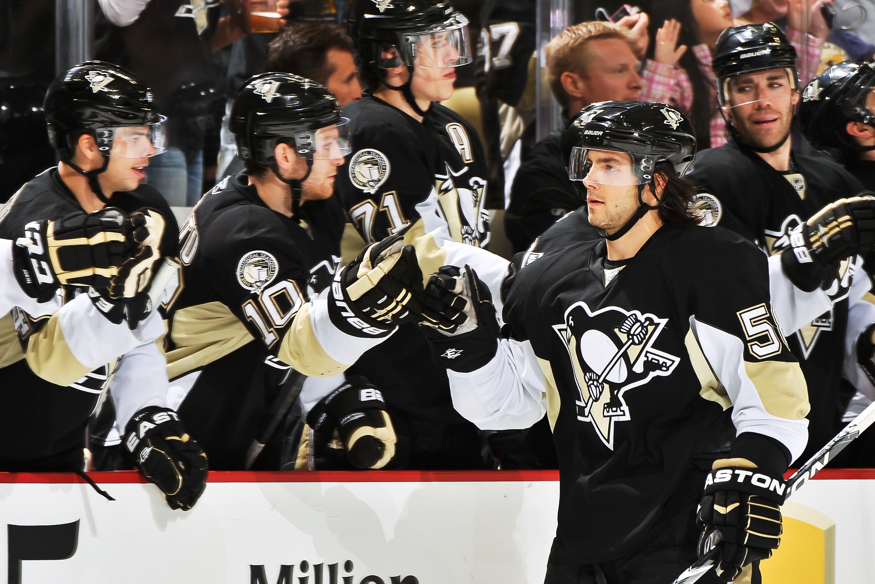 PITTSBURGH - NOVEMBER 19:  Kris Letang #58 of the Pittsburgh Penguins is congratulated by the bench after scoring a shoot out goal against the Carolina Hurricanes on November 19, 2010 at Consol Energy Center in Pittsburgh, Pennsylvania.  (Photo by Jamie S