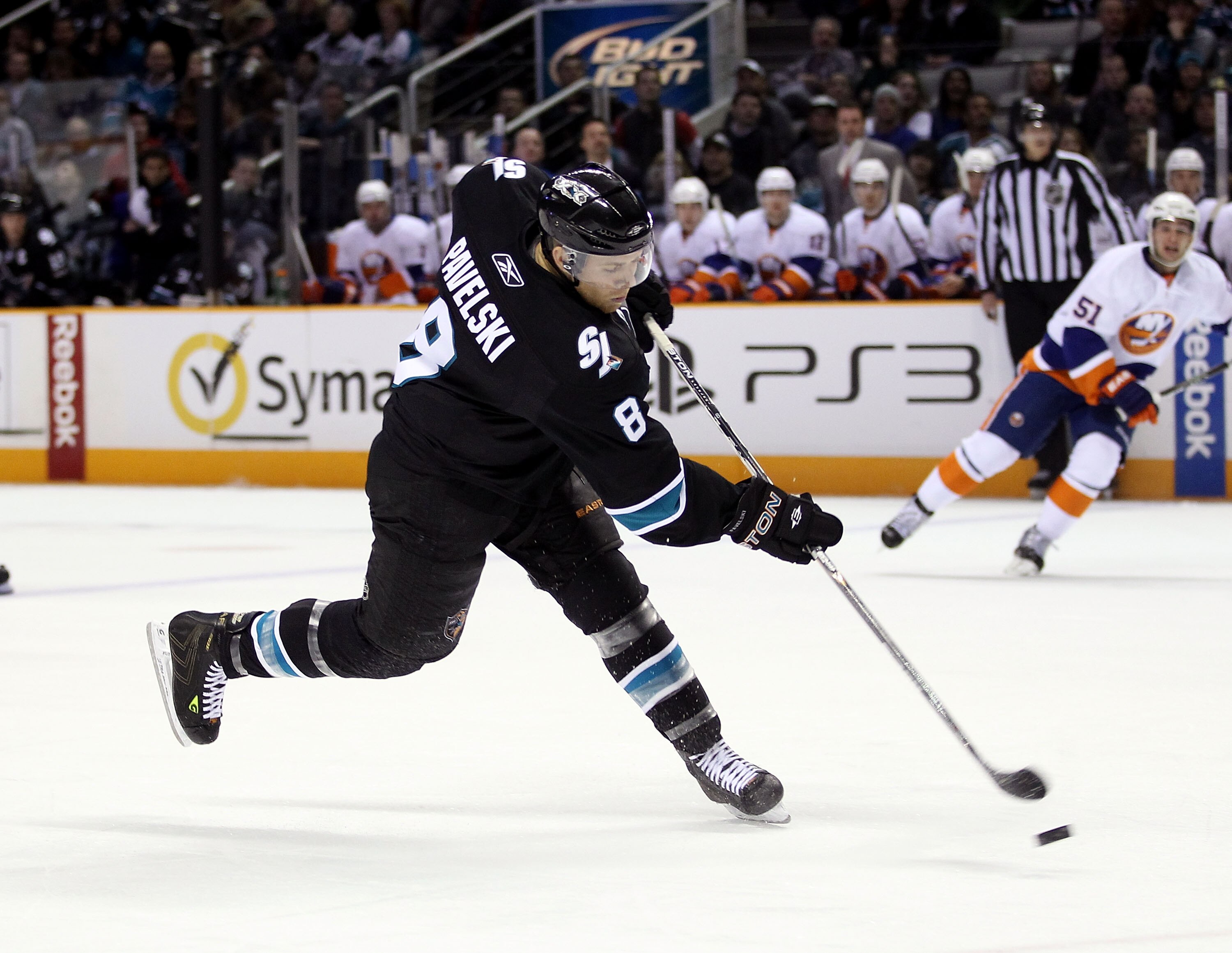 SAN JOSE, CA - NOVEMBER 11:  Joe Pavelski #8 of the San Jose Sharks puts a shot on goal during their game against the New York Islanders on November 11, 2010 in San Jose, California.  (Photo by Ezra Shaw/Getty Images)
