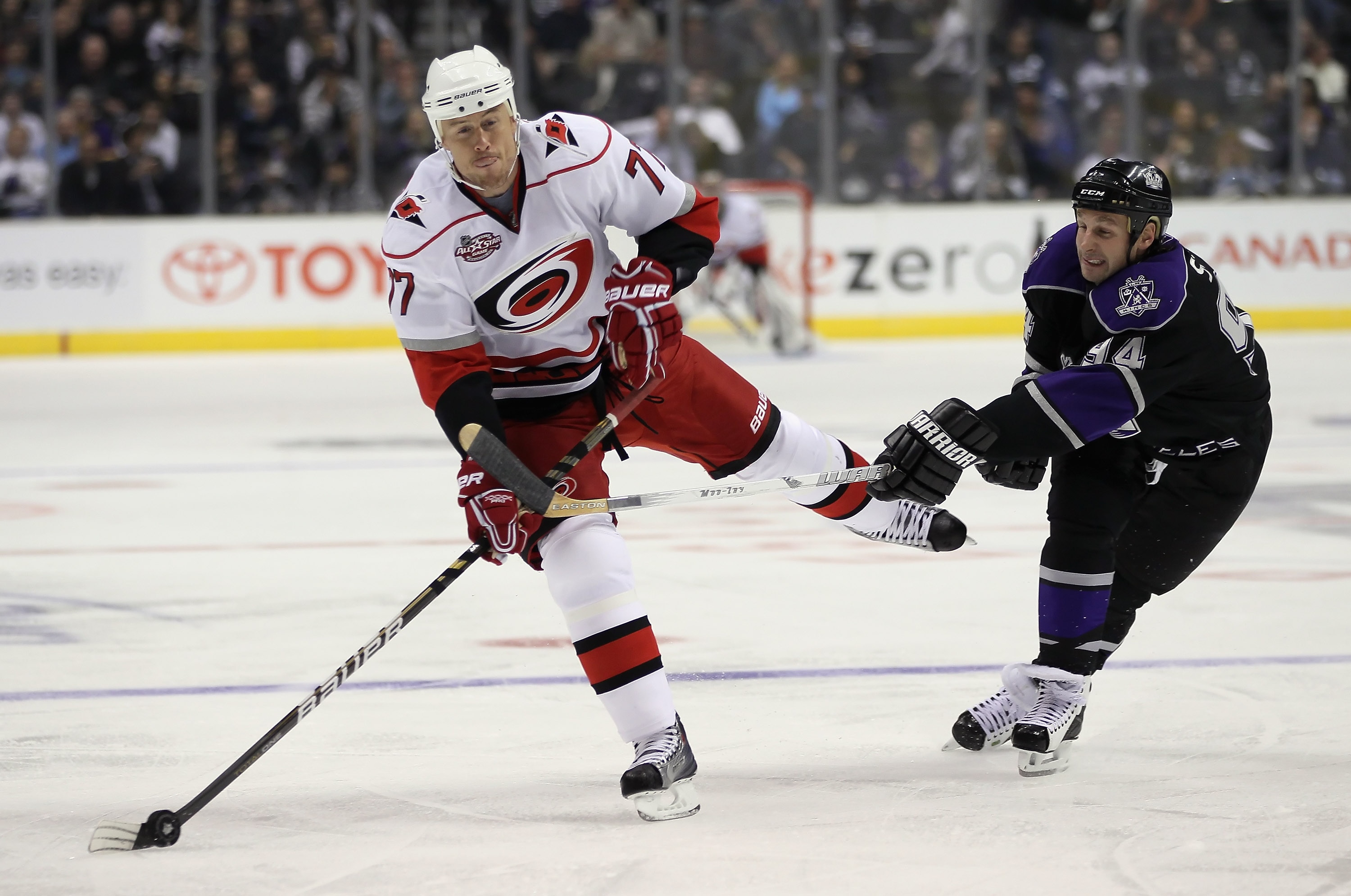 LOS ANGELES, CA - OCTOBER 20:  Joe Corvo #77 of the Carolina Hurricanes is slashed by Ryan Smyth #94 of the Los Angeles Kings during the first period at Staples Center on October 20, 2010 in Los Angeles, California.  (Photo by Jeff Gross/Getty Images)