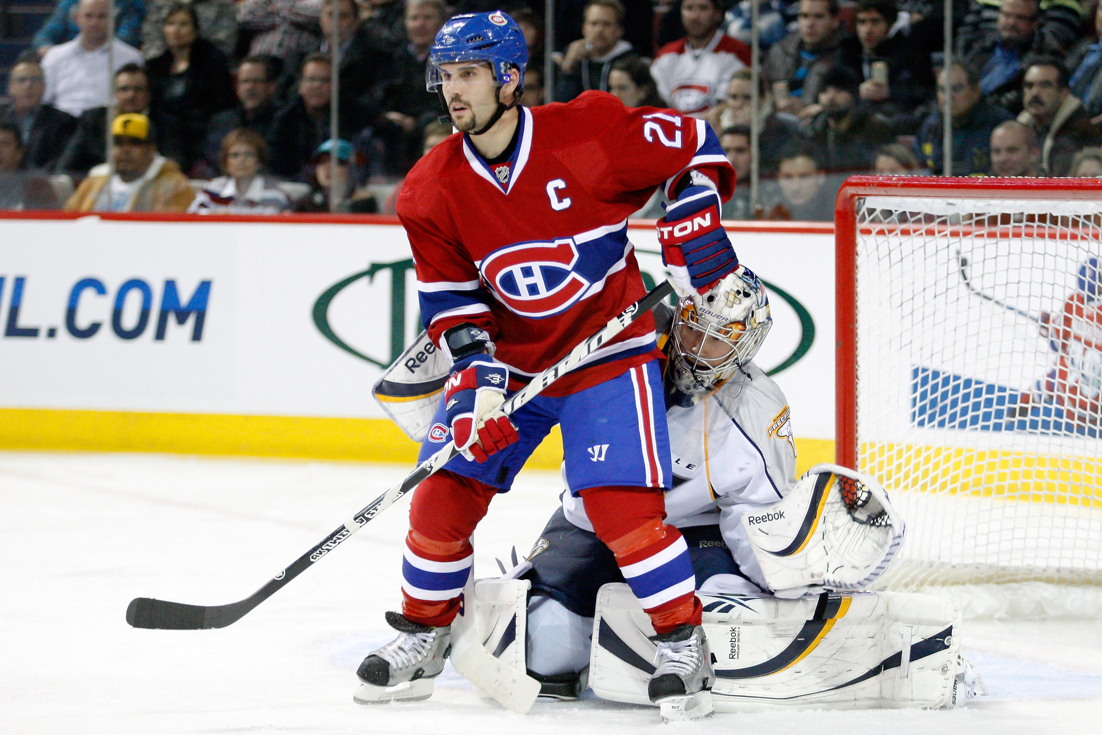 MONTREAL- NOVEMBER 18: Pekka Rinne #35 of the Nashville Predators watches play from behind Brian Gionta #21 of the Montreal Canadiens during the NHL game at the Bell Centre on November 18, 2010 in Montreal, Quebec, Canada. The Predators defeated the Can MONTREAL- NOVEMBER 18: Pekka Rinne #35 of the Nashville Predators watches play from behind Brian Gionta #21 of the Montreal Canadiens during the NHL game at the Bell Centre on November 18, 2010 in Montreal, Quebec, Canada. The Predators defeated the Can