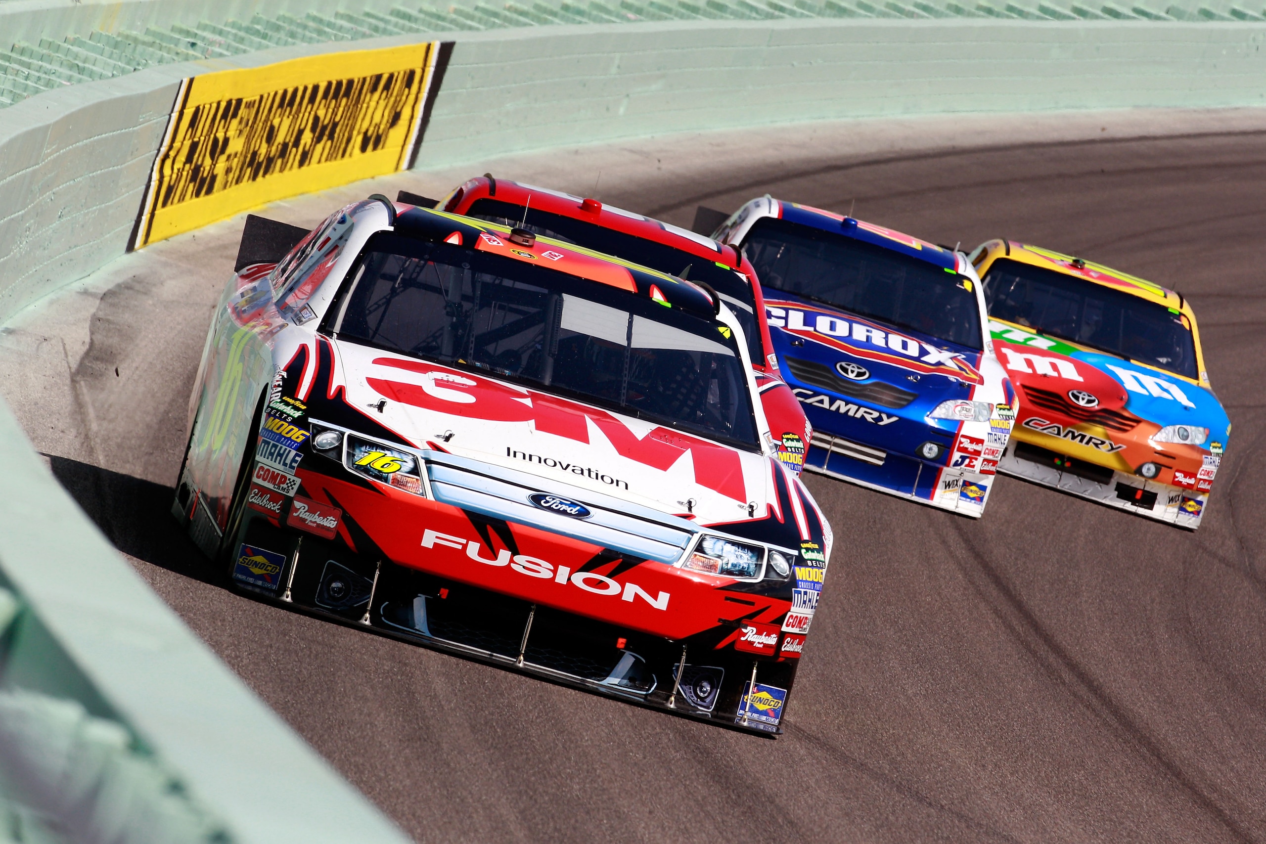HOMESTEAD, FL - NOVEMBER 21:  Greg Biffle, driver of the #16 3M Ford, leads a group of cars during the NASCAR Sprint Cup Series Ford 400 at Homestead-Miami Speedway on November 21, 2010 in Homestead, Florida.  (Photo by Sam Greenwood/Getty Images)