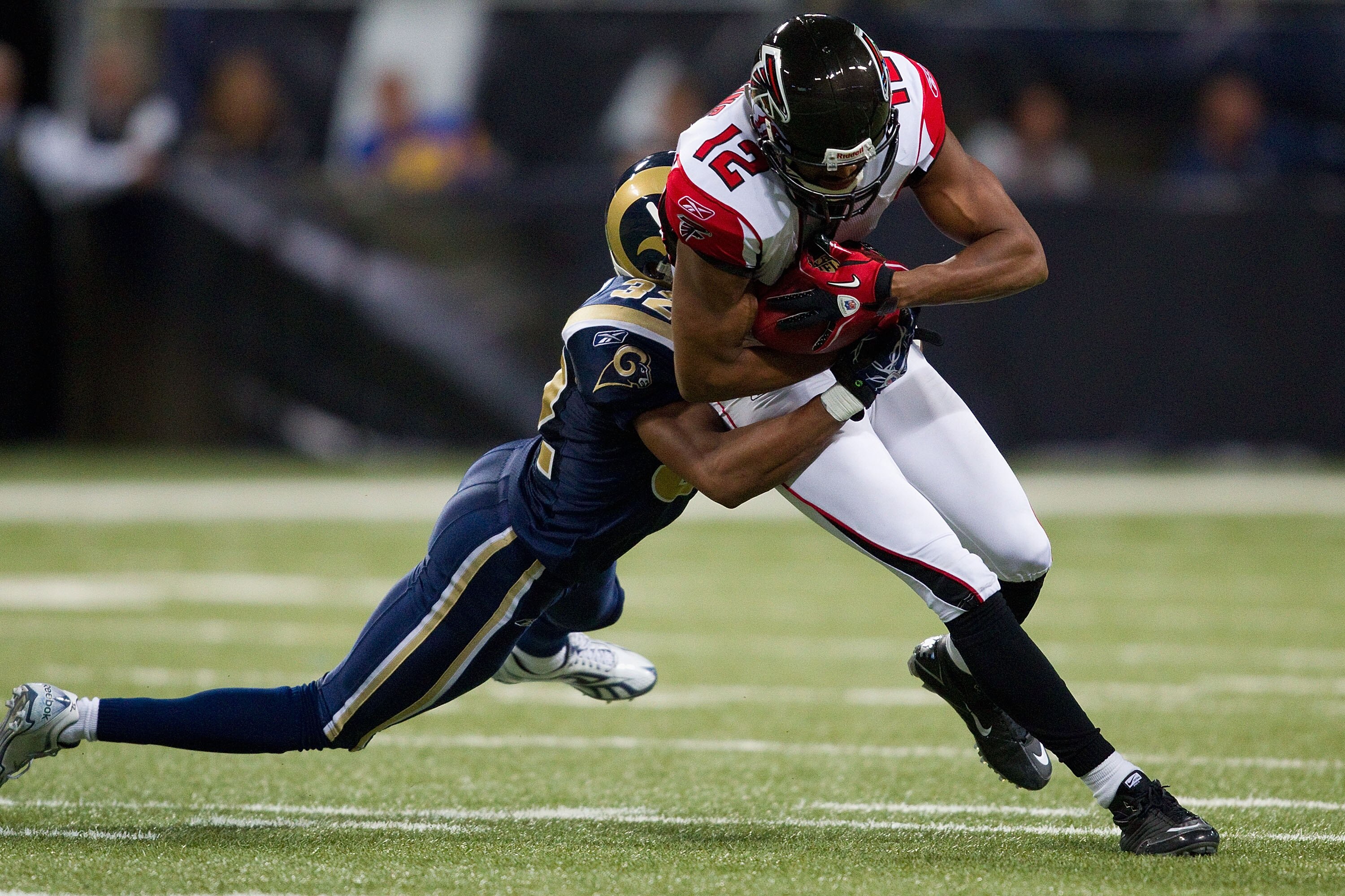ST. LOUIS - NOVEMBER 21: Michael Jenkins #12 of the Atlanta Falcons catches a pass against the St. Louis Rams at the Edward Jones Dome on November 21, 2010 in St. Louis, Missouri.  The Falcons beat the Rams 34-17.  (Photo by Dilip Vishwanat/Getty Images)