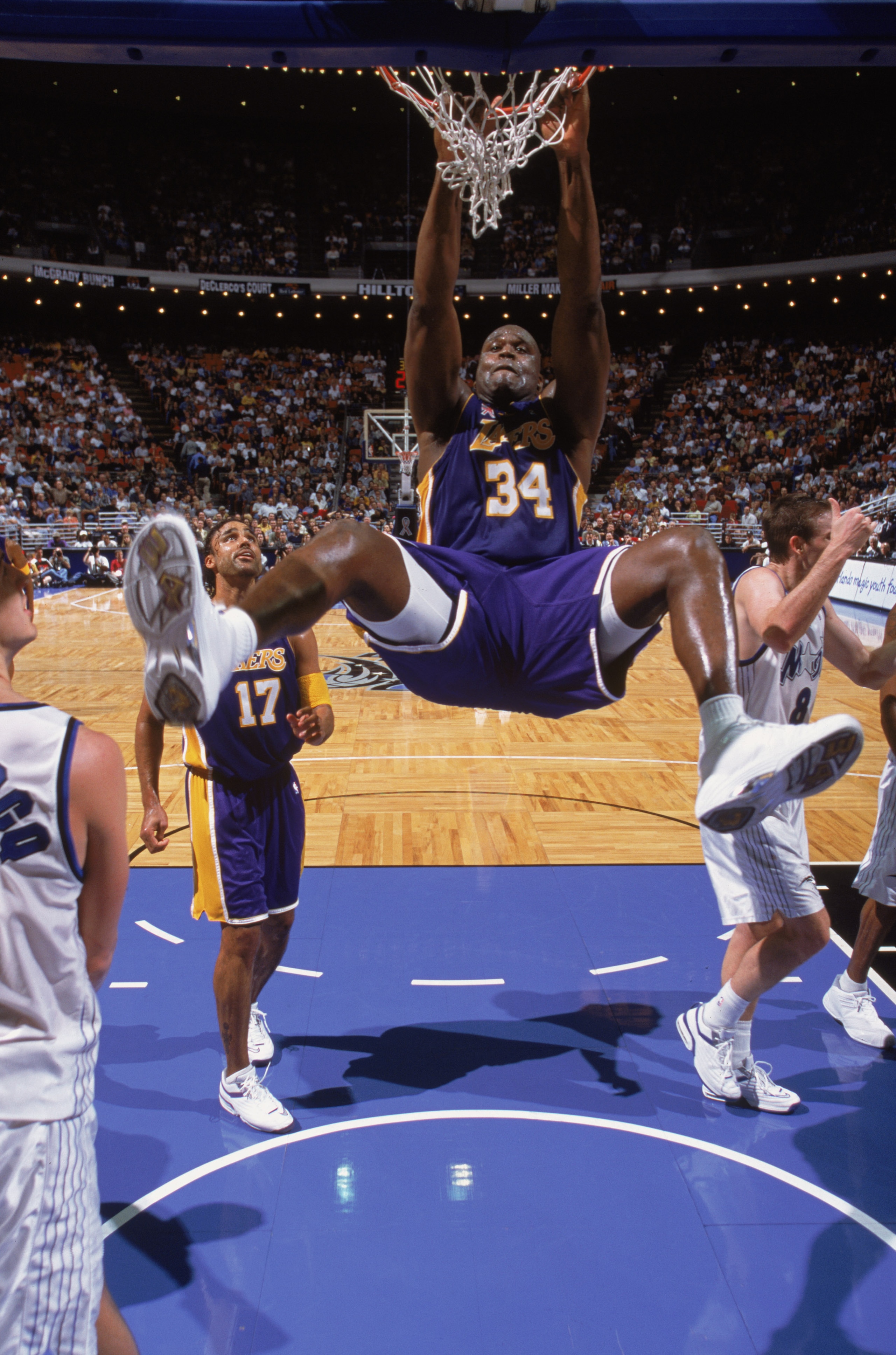 30 Jan 2002:  Center Shaquille O''Neal #34 of the Los Angeles Lakers hangs from the basket during the NBA game against the Orlando Magic at the TD Waterhouse in Orlando, Florida.  The Lakers defeated the Magic 111-93.  NOTE TO USER:  User expressly acknow