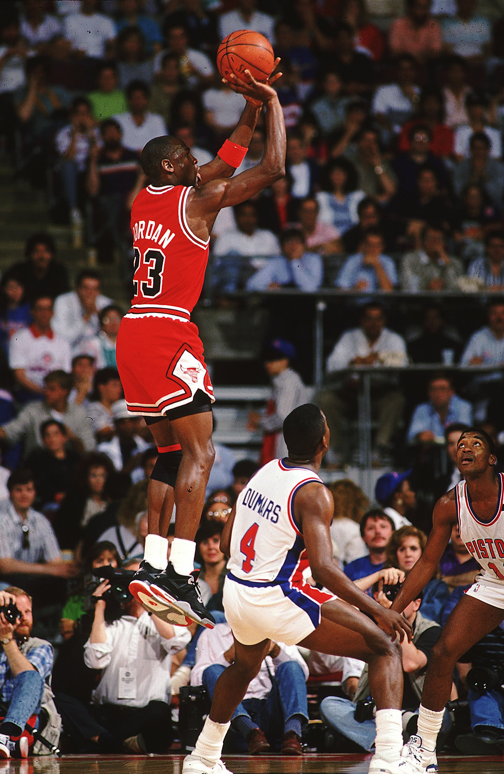 1988:  Michael Jordan #23 of the Chicago Bulls jumps to shoot the ball during a game against the Detroit Pistons. NOTE TO USER: It is expressly understood that the only rights Allsport are offering to license in this Photograph are one-time, non-exclusive