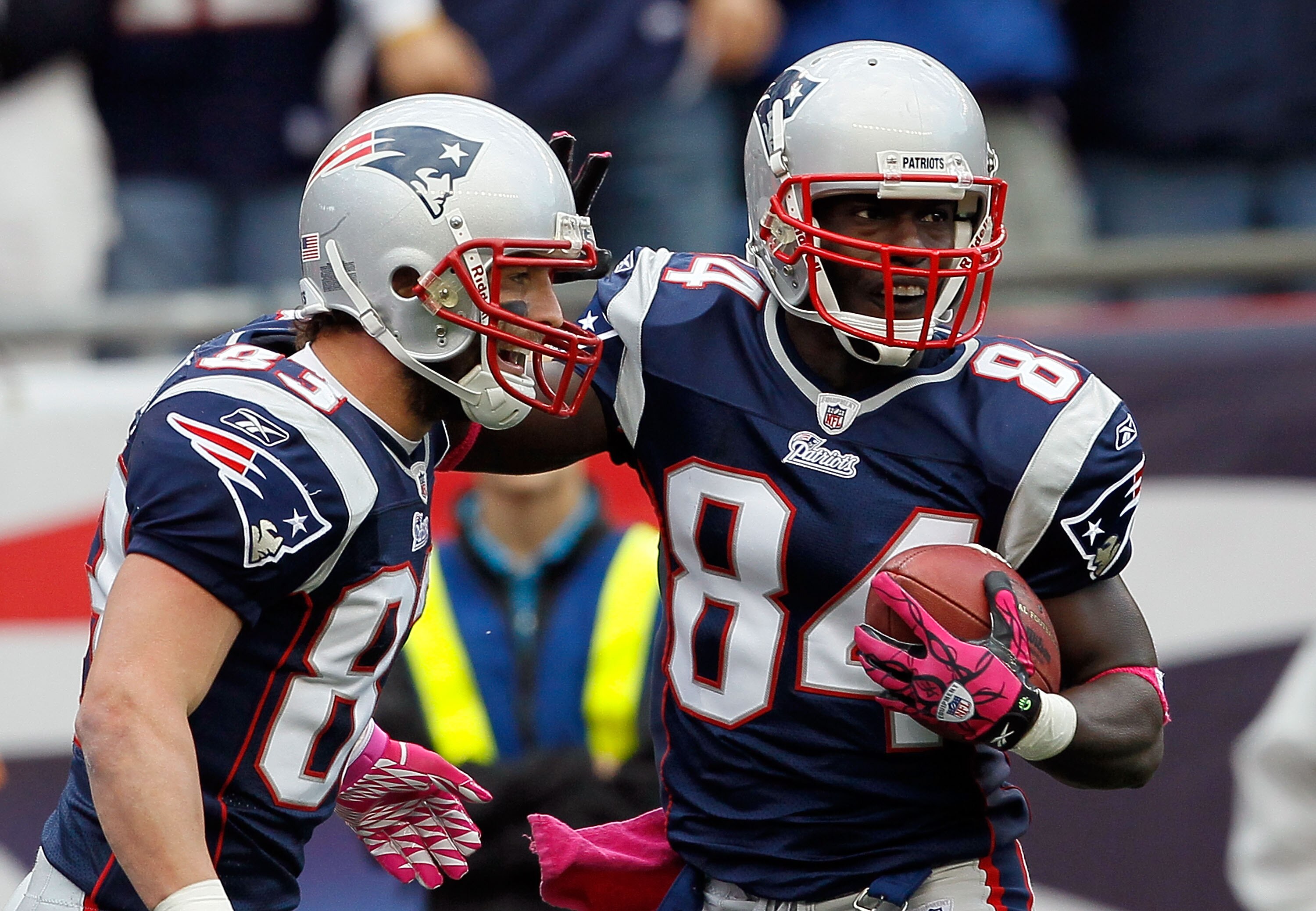 FOXBORO, MA - OCTOBER 17:  Wes Welker #83 celebrate with teammate Deion Branch #84, both of the New England Patriots, after Branch caught a touchdown pass in the second half against the Baltimore Ravens at Gillette Stadium on October 17, 2010 in Foxboro, 