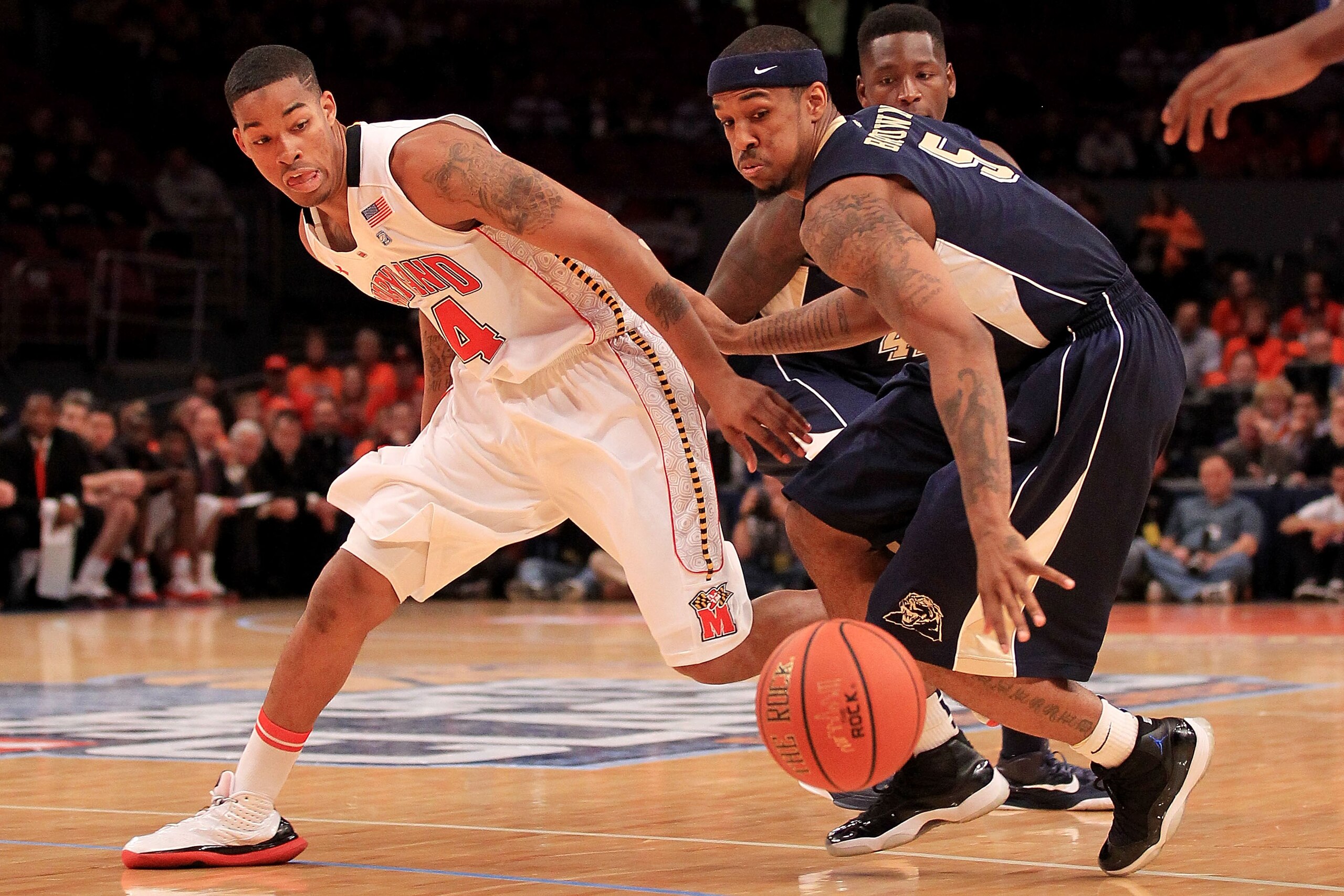 NEW YORK - NOVEMBER 18: Gilbert Brown #5 of the Pittsburgh Panther contests the ball with Cliff Tucker #24 of the Maryland Terrapins during the 2k Sports Classic at Madison Square Garden on November 18, 2010 in New York, New York.  (Photo by Chris McGrath