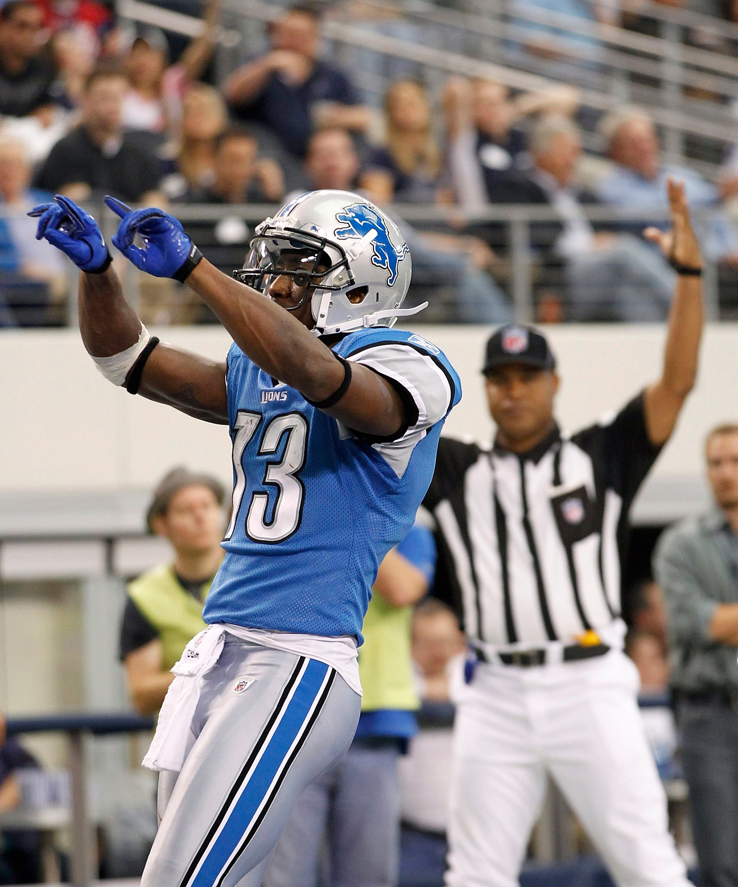 ARLINGTON, TX - NOVEMBER 21: Nate Burleson #13 of the Detroit Lions scores a late second quarter touchdown against the Dallas Cowboys at Dallas Stadium on November 21, 2010 in Arlington, Texas. (Photo by Leon Halip/Getty Images)