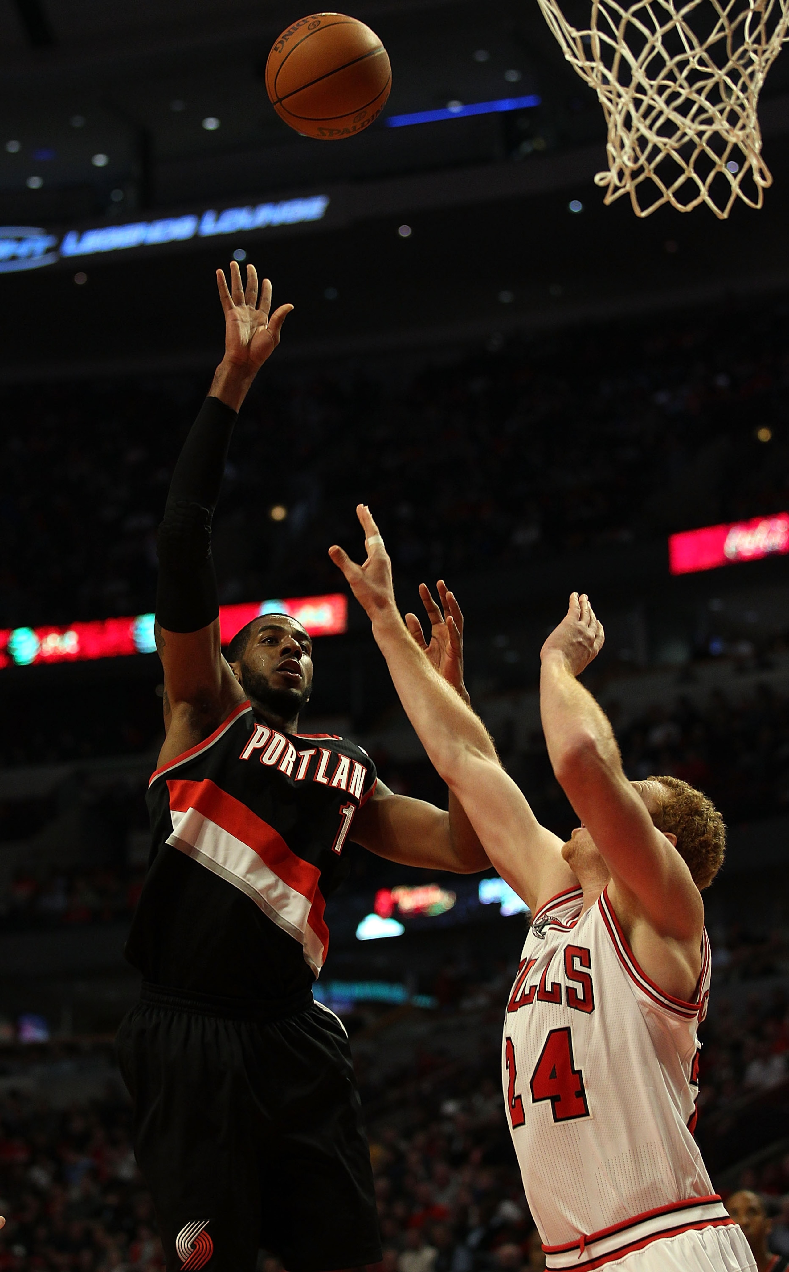 CHICAGO - NOVEMBER 01: LaMarcus Aldridge #12 of the Portland Trail Blazers puts up a shot over Brian Scalabrine #24 of the Chicago Bulls at the United Center on November 1, 2010 in Chicago, Illinois. The Bulls defeated the Trail Blazers 110-98. NOTE TO US