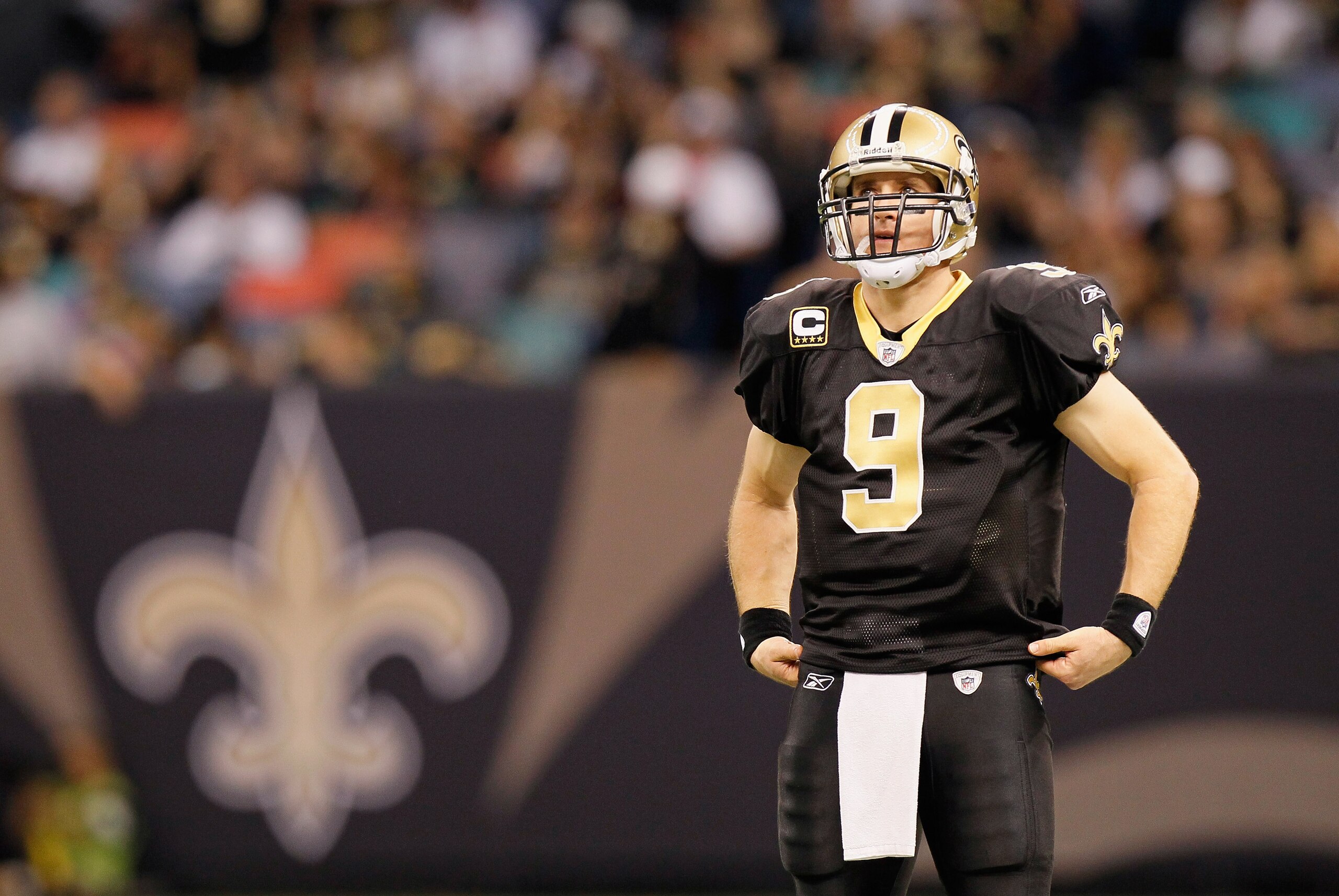 NEW ORLEANS - NOVEMBER 21: Quarterback Drew Brees #9 of the New Orleans Saints waits during a timeout against the Seattle Seahawks at Louisiana Superdome on November 21, 2010 in New Orleans, Louisiana. (Photo by Kevin C. Cox/Getty Images) NEW ORLEANS - NOVEMBER 21: Quarterback Drew Brees #9 of the New Orleans Saints waits during a timeout against the Seattle Seahawks at Louisiana Superdome on November 21, 2010 in New Orleans, Louisiana. (Photo by Kevin C. Cox/Getty Images)