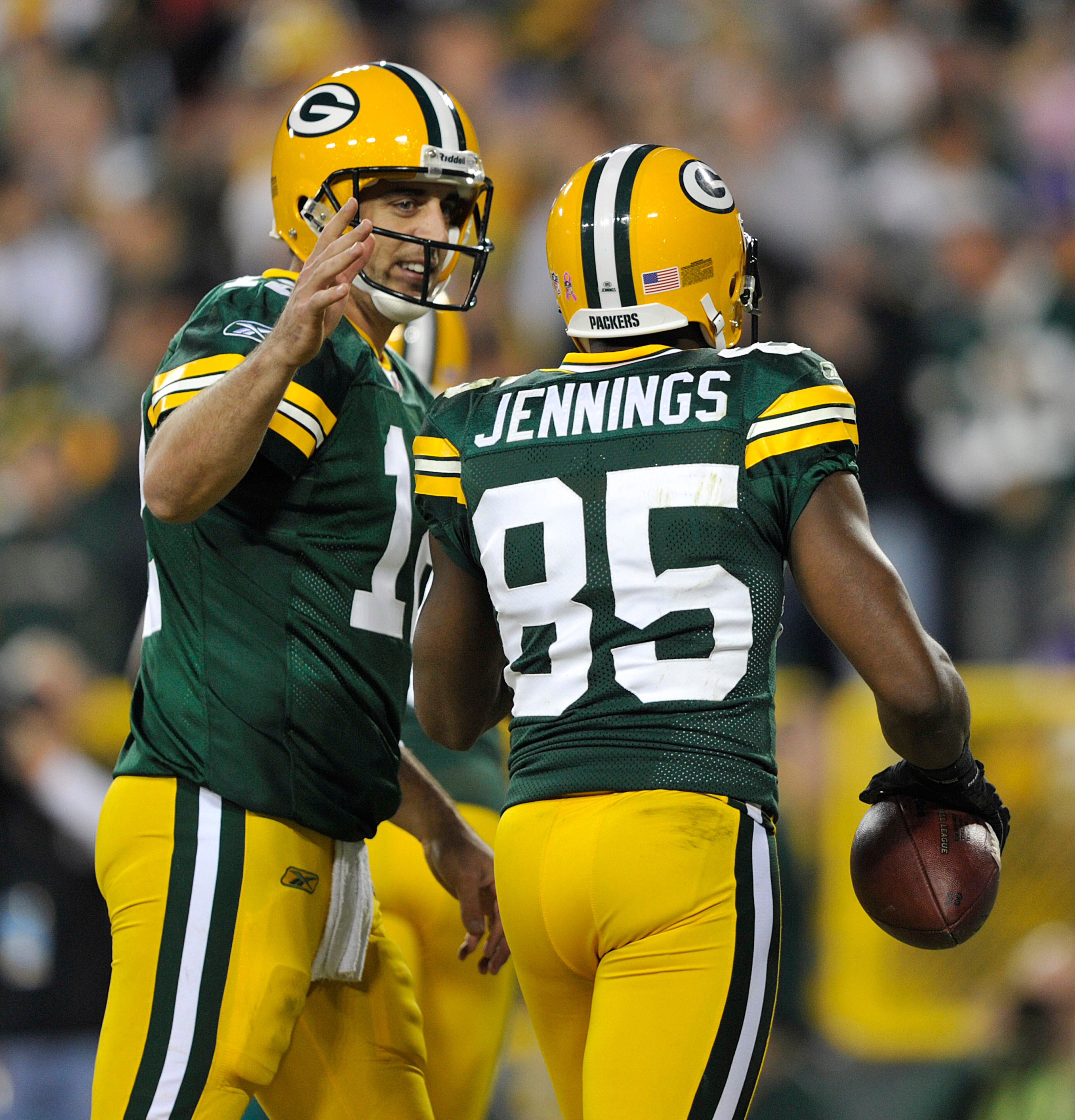 GREEN BAY, WI - OCTOBER 24:  Aaron Rodgers #12 of the Green Bay Packers congratulates Greg Jennings #85 after Jennings' touchdown against the Minnesota Vikings  at Lambeau Field on October 24, 2010 in Green Bay, Wisconsin. (Photo by Jim Prisching/Getty Im