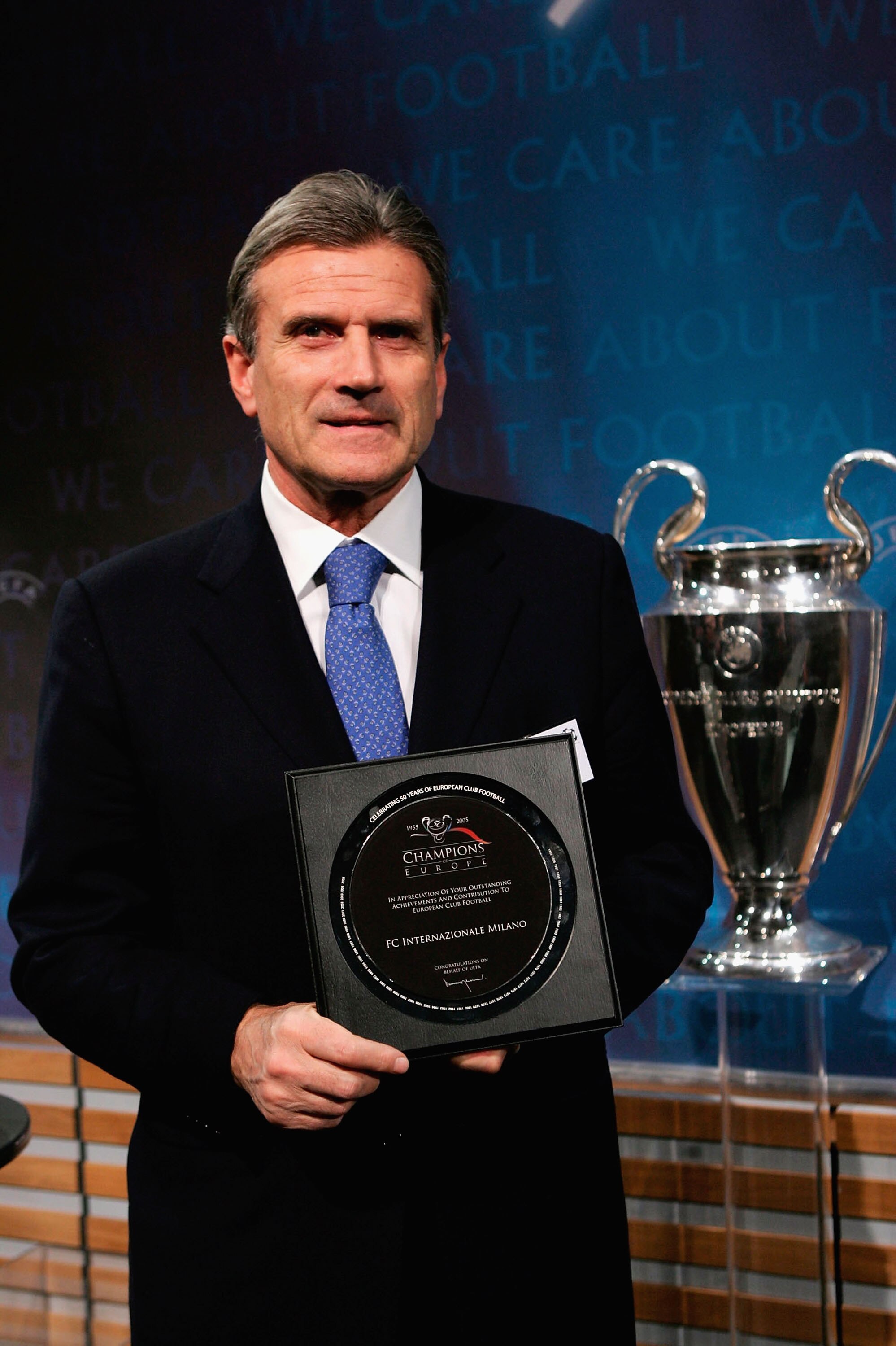 NYON, SWITZERLAND - DECEMBER 16:  Giacinto Facchetti of Inter Milan receives a plaque during the draw for the knock-out round of the Champions League at the UEFA headquarters on December 16, 2005 in Nyon, Switzerland. (Photo by John Gichigi/Getty Images)