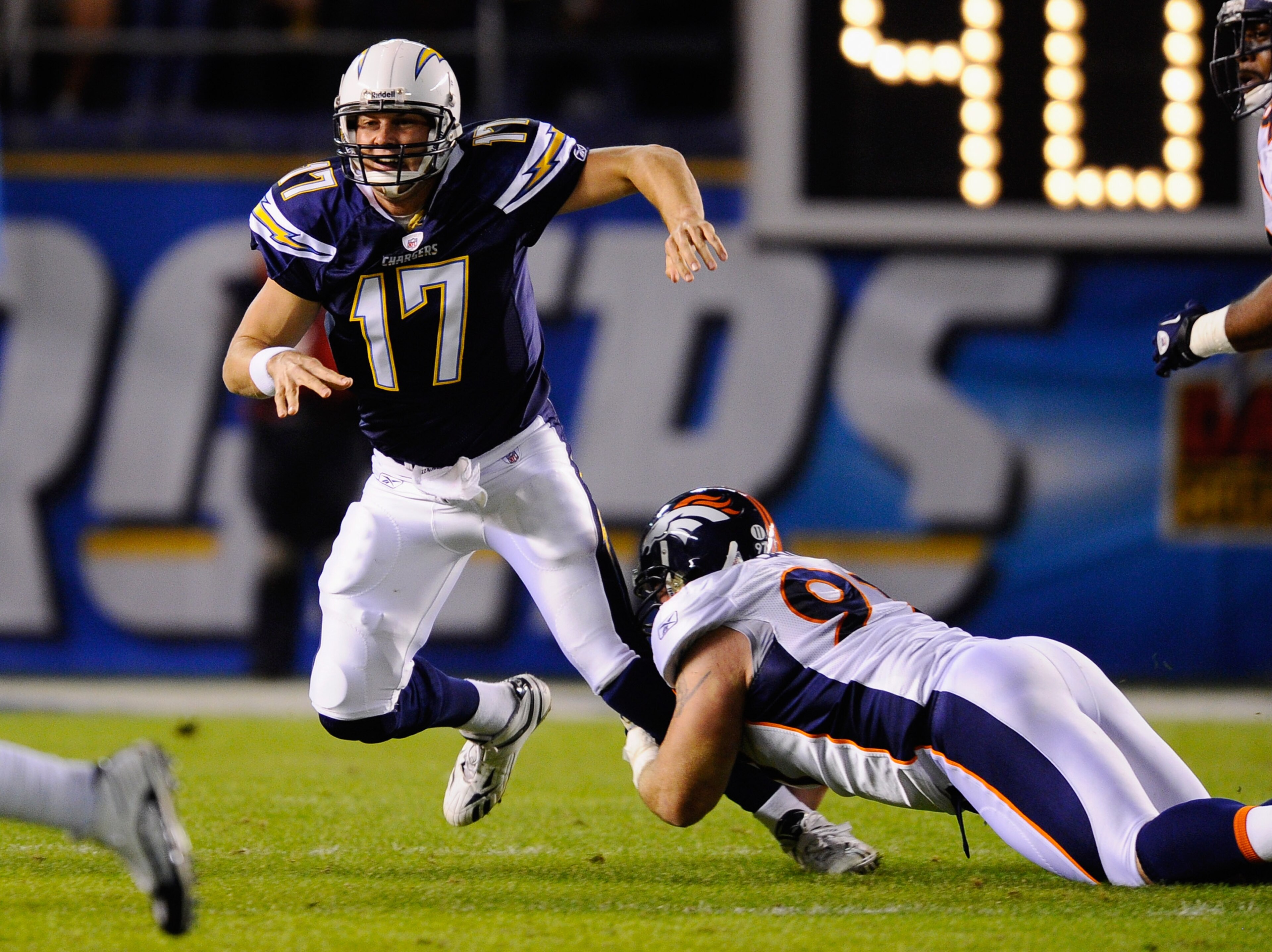 SAN DIEGO - NOVEMBER 22:  Quarterback Philip Rivers #17 of the San Diego Chargers throws an incomplete pass under pressure from Justin Bannan #27 of the Denver Broncos at Qualcomm Stadium on November 22, 2010 in San Diego, California.  (Photo by Kevork Dj