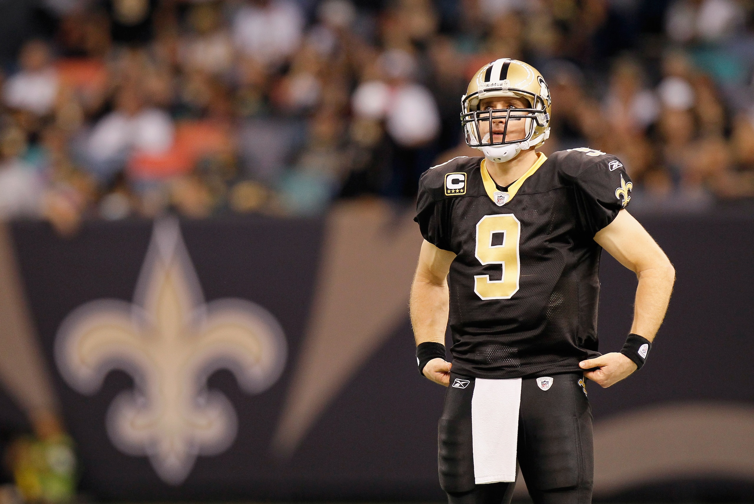 NEW ORLEANS - NOVEMBER 21:  Quarterback Drew Brees #9 of the New Orleans Saints waits during a timeout against the Seattle Seahawks at Louisiana Superdome on November 21, 2010 in New Orleans, Louisiana.  (Photo by Kevin C. Cox/Getty Images)