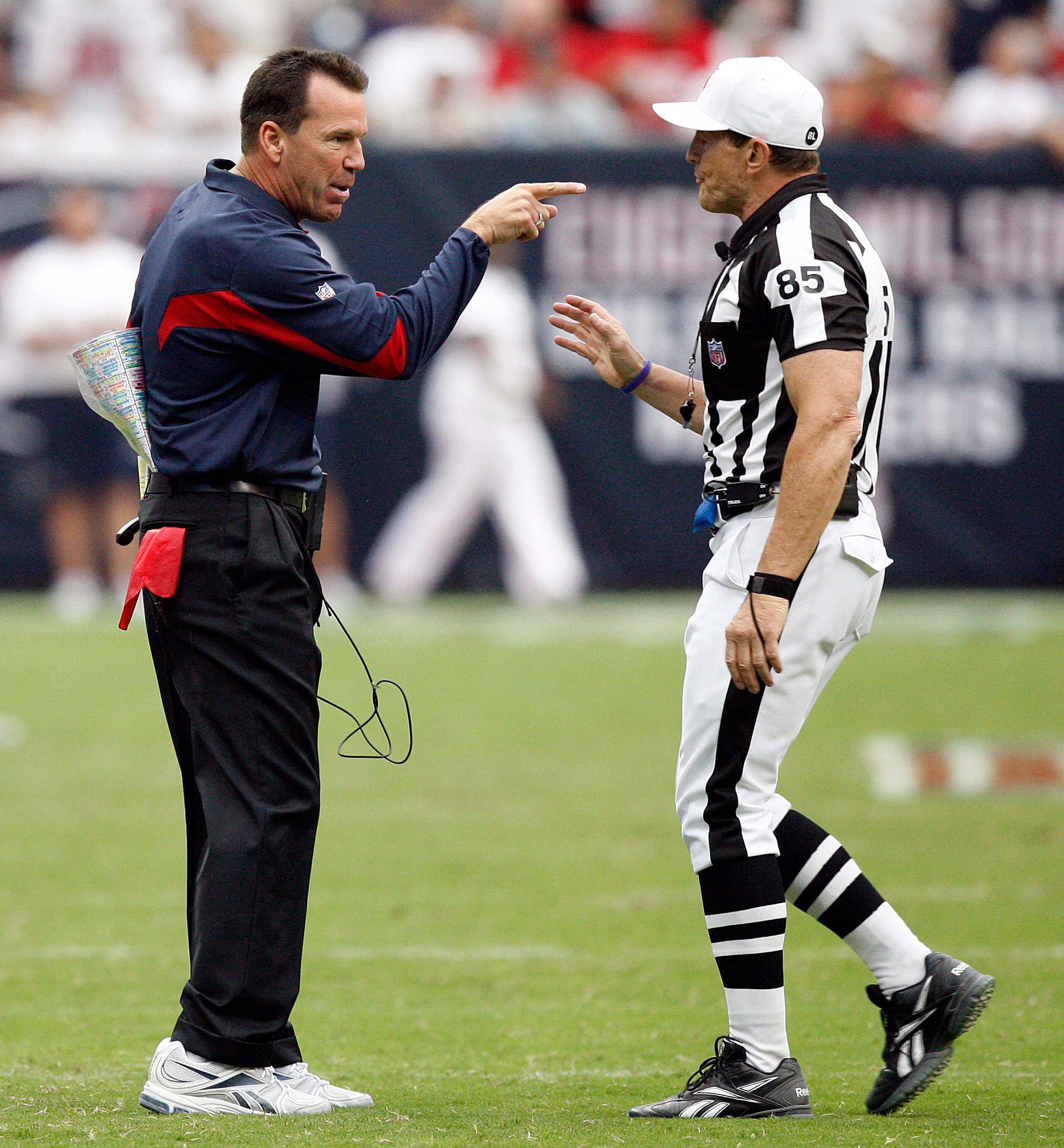 HOUSTON - SEPTEMBER 12:  Houston Texans head coach Gary Kubiak has words with referee Ed Hochuli after the Texans were charged with a timeout after the play clock was zero against the indianapolis Colts during the NFL season opener at Reliant Stadium on S