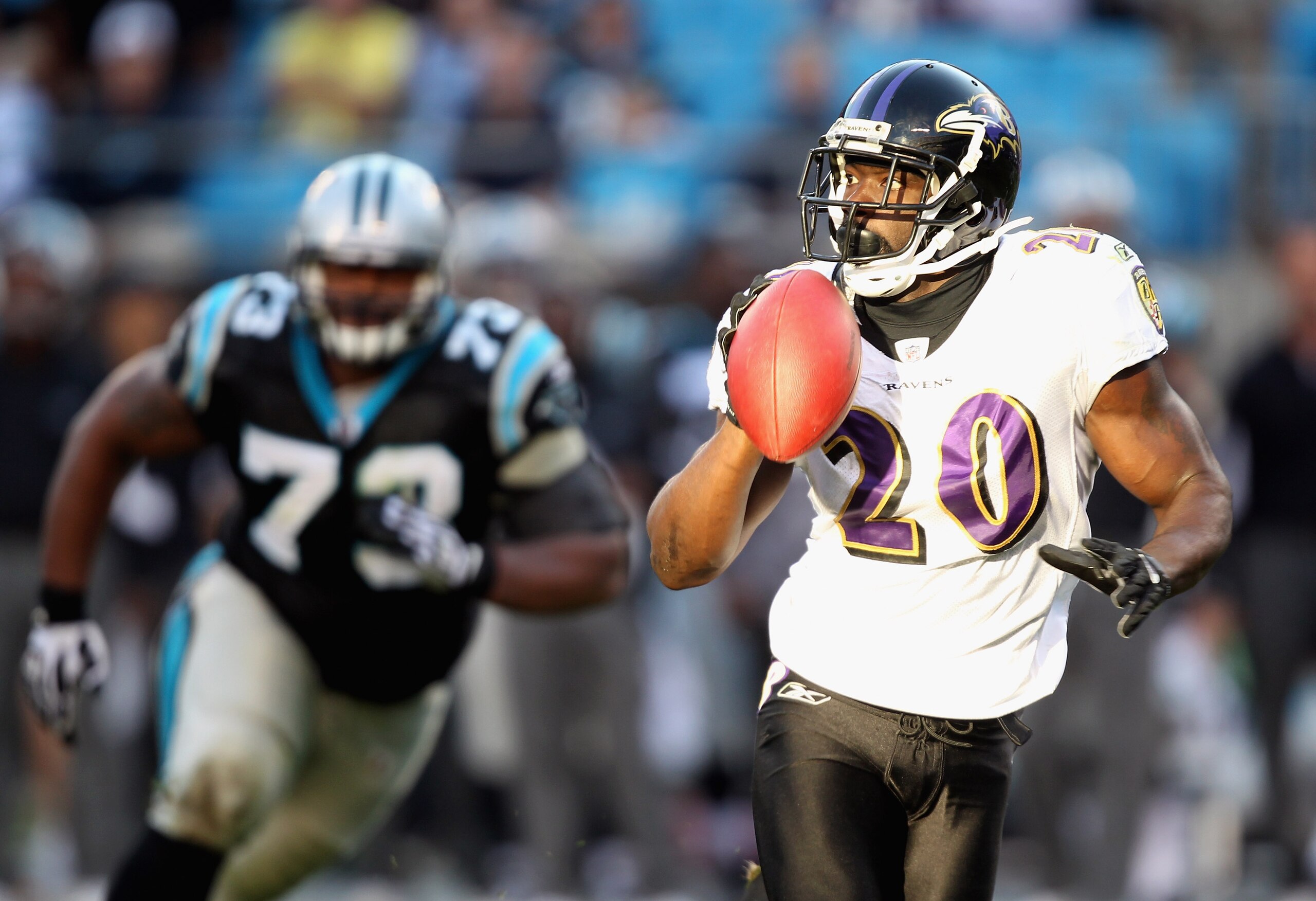 CHARLOTTE, NC - NOVEMBER 21:  Ed Reed #20 of the Baltimore Ravens passes the ball to a teammate after an interception against the Carolina Panthers at Bank of America Stadium on November 21, 2010 in Charlotte, North Carolina.  (Photo by Streeter Lecka/Get