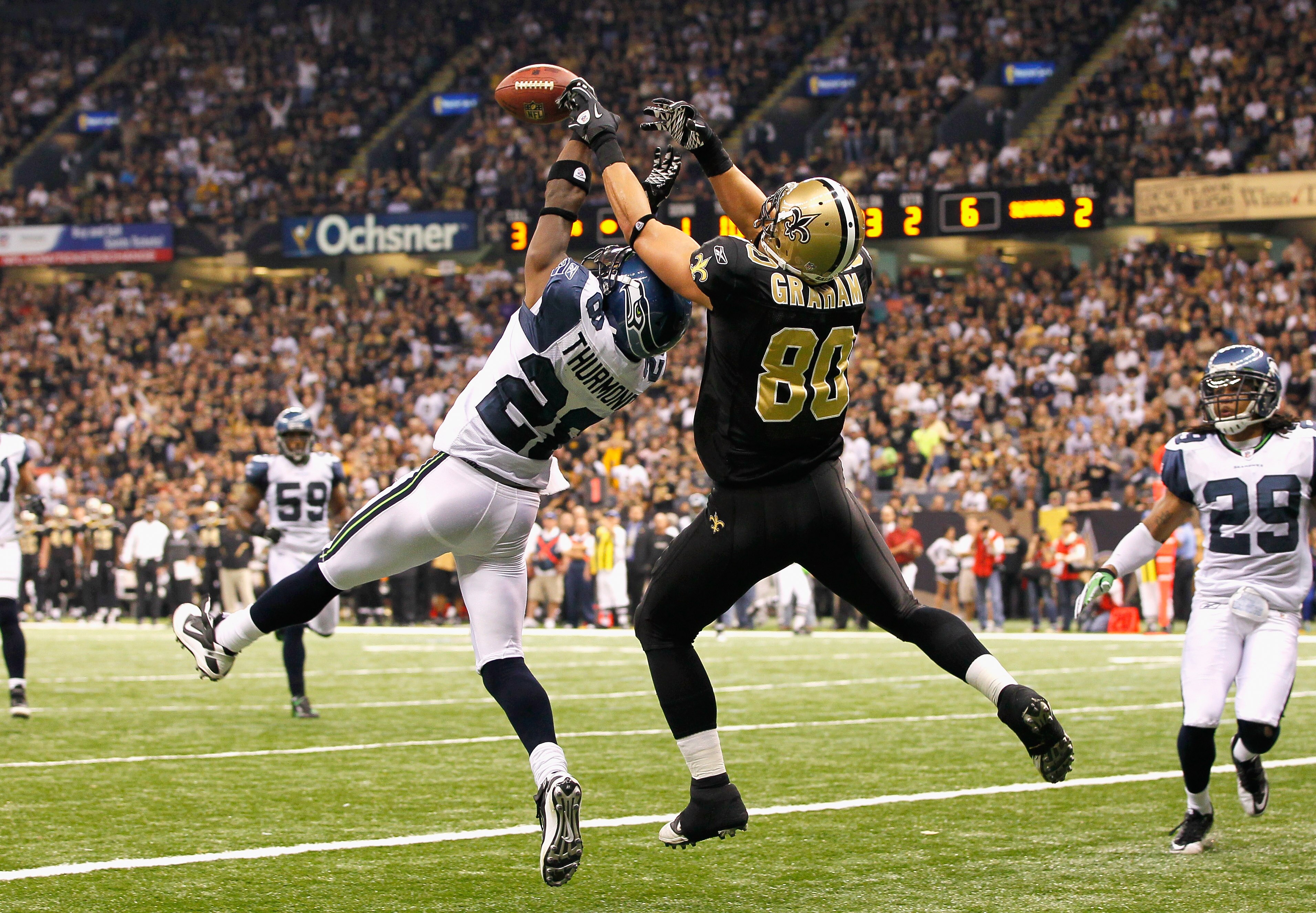 NEW ORLEANS - NOVEMBER 21:  Walter Thurmond #28 of the Seattle Seahawks breaks up a touchdown reception intended for Jimmy Graham #80 of the New Orleans Saints at Louisiana Superdome on November 21, 2010 in New Orleans, Louisiana.  (Photo by Kevin C. Cox/