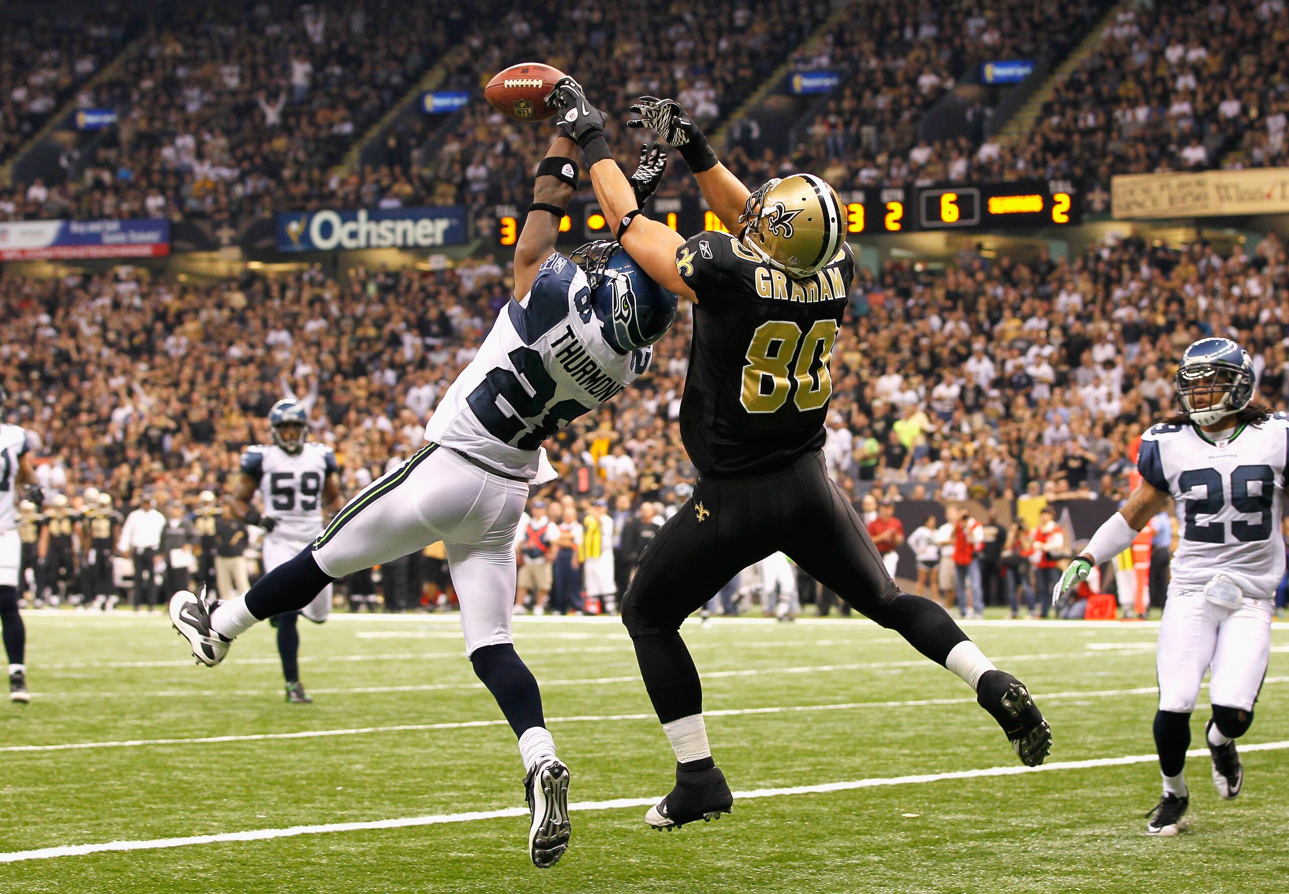 NEW ORLEANS - NOVEMBER 21:  Walter Thurmond #28 of the Seattle Seahawks breaks up a touchdown reception intended for Jimmy Graham #80 of the New Orleans Saints at Louisiana Superdome on November 21, 2010 in New Orleans, Louisiana.  (Photo by Kevin C. Cox/