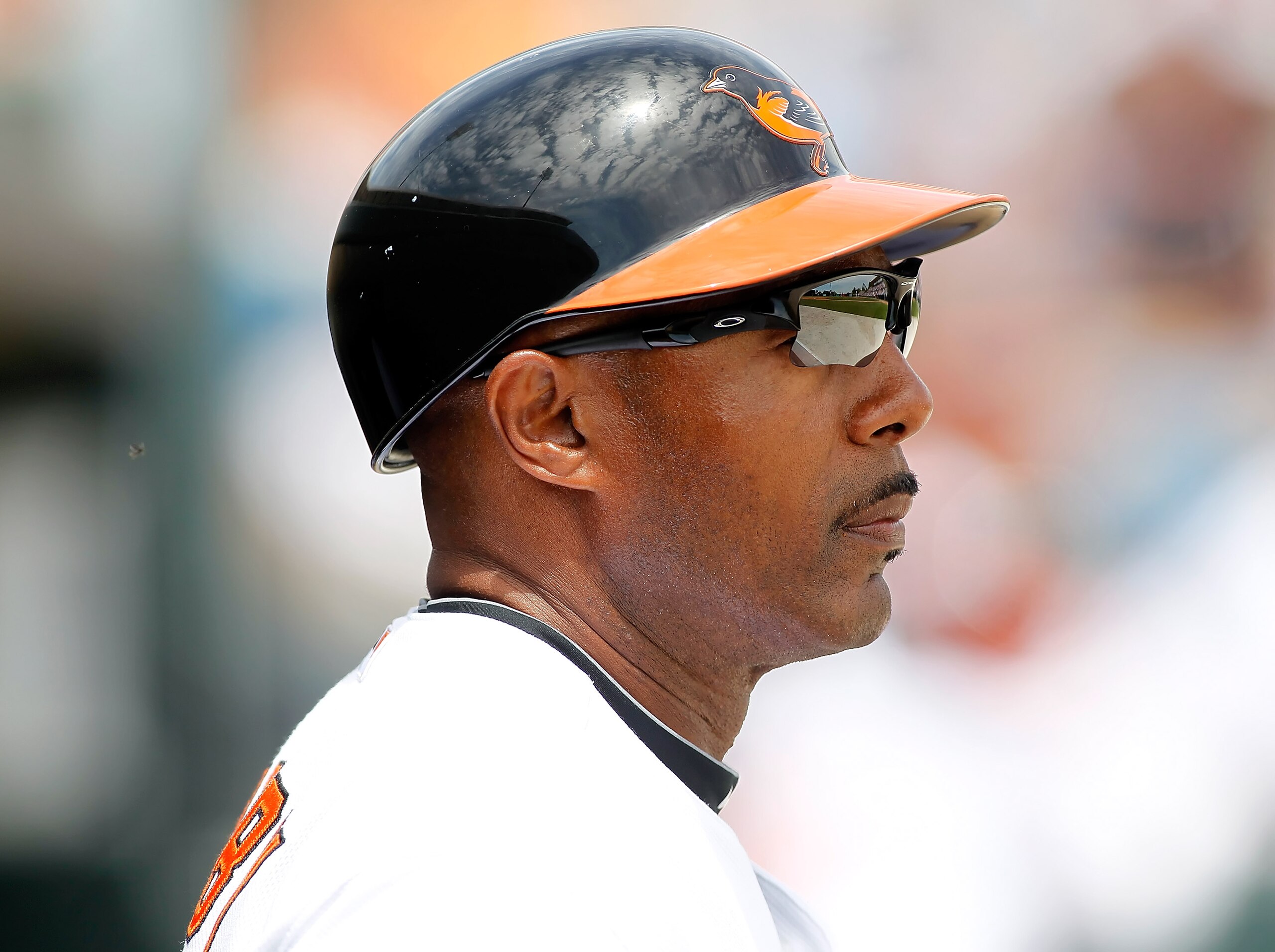 SARASOTA, FL - APRIL 03:  First base coach John Shelby #38 of the Baltimore Orioles watches his team from the dugout against the New York Mets during a Grapefruit League Spring Training Game at Ed Smith Stadium on April 3, 2010 in Sarasota, Florida.  (Pho