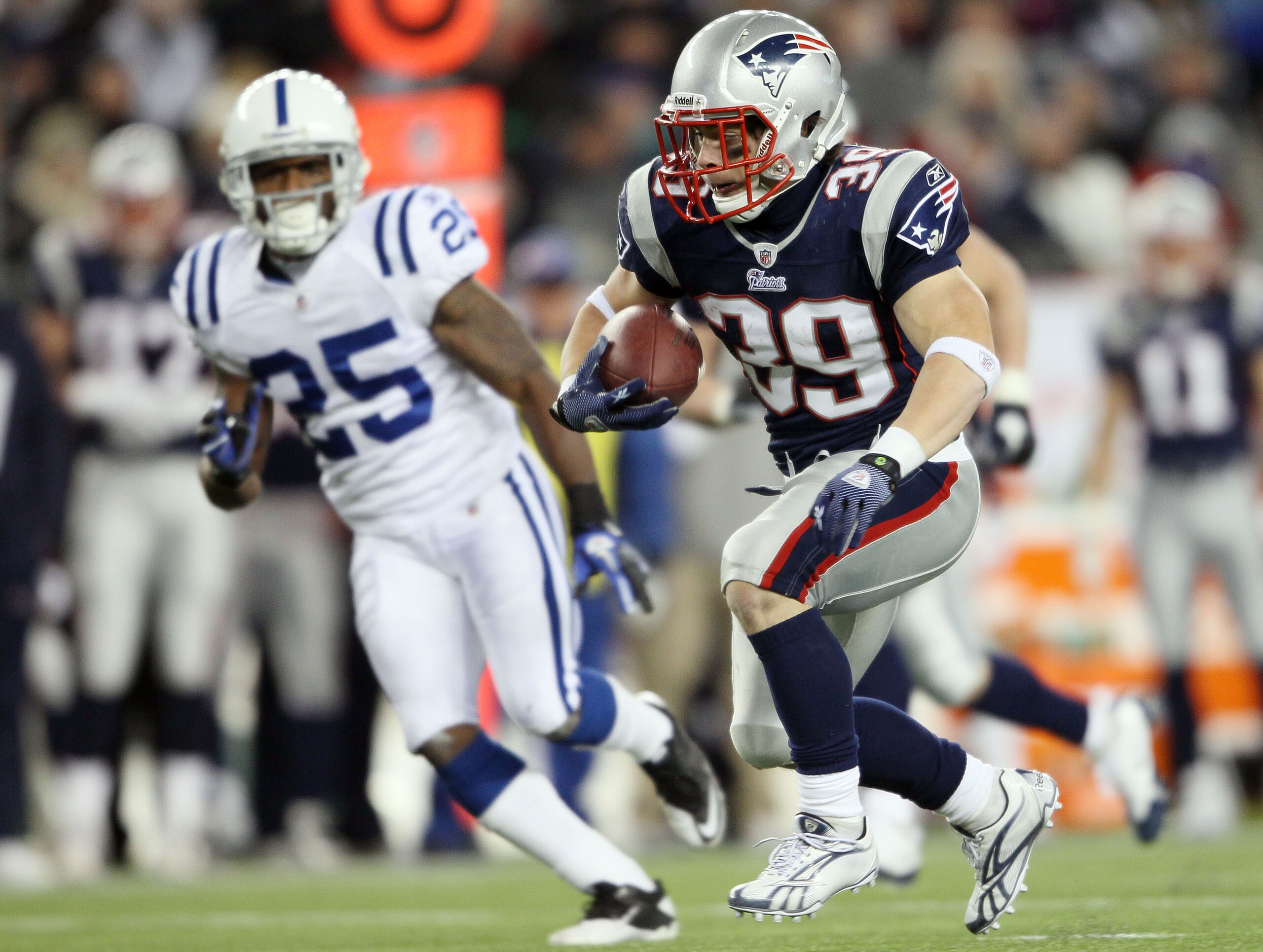 FOXBORO, MA - NOVEMBER 21:   Danny Woodhead #39 of the New England Patriots carries the ball as Jerraud Powers #25 of the Indianapolis Colts defends on November 21, 2010 at Gillette Stadium in Foxboro, Massachusetts. The Patriots defeated the Colts 31-28.