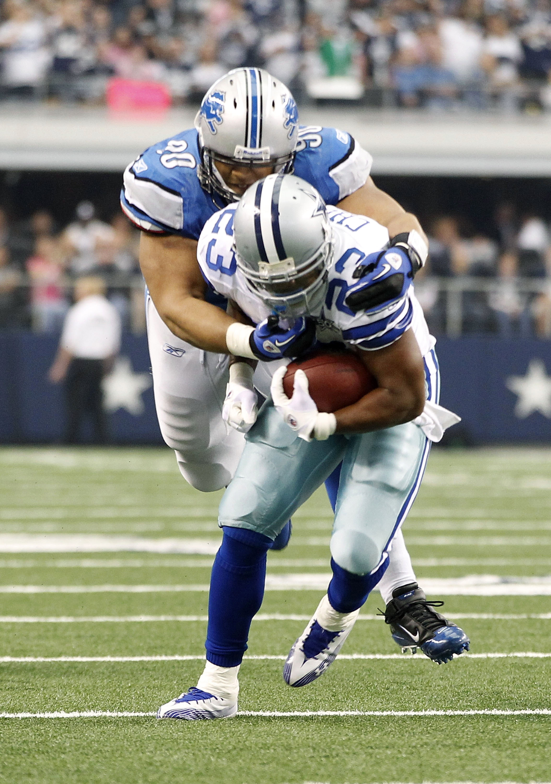 ARLINGTON, TX - NOVEMBER 21: Ndamukong Suh #90 of the Detroit Lions tackles Tashard Choice #23 of the Dallas Cowboys during the game at Dallas Stadium on November 21, 2010 in Arlington, Texas. The Cowboys defeated the Lions 35-19. (Photo by Leon Halip/Get
