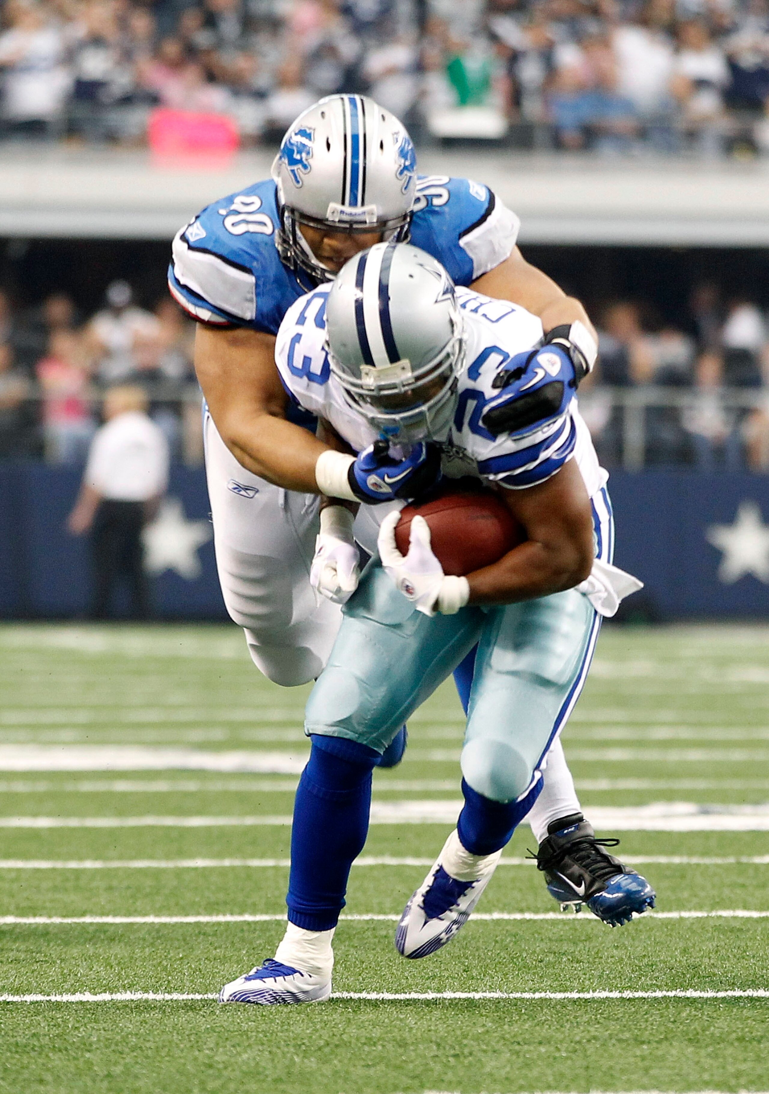 ARLINGTON, TX - NOVEMBER 21: Ndamukong Suh #90 of the Detroit Lions tackles Tashard Choice #23 of the Dallas Cowboys during the game at Dallas Stadium on November 21, 2010 in Arlington, Texas. The Cowboys defeated the Lions 35-19. (Photo by Leon Halip/Get