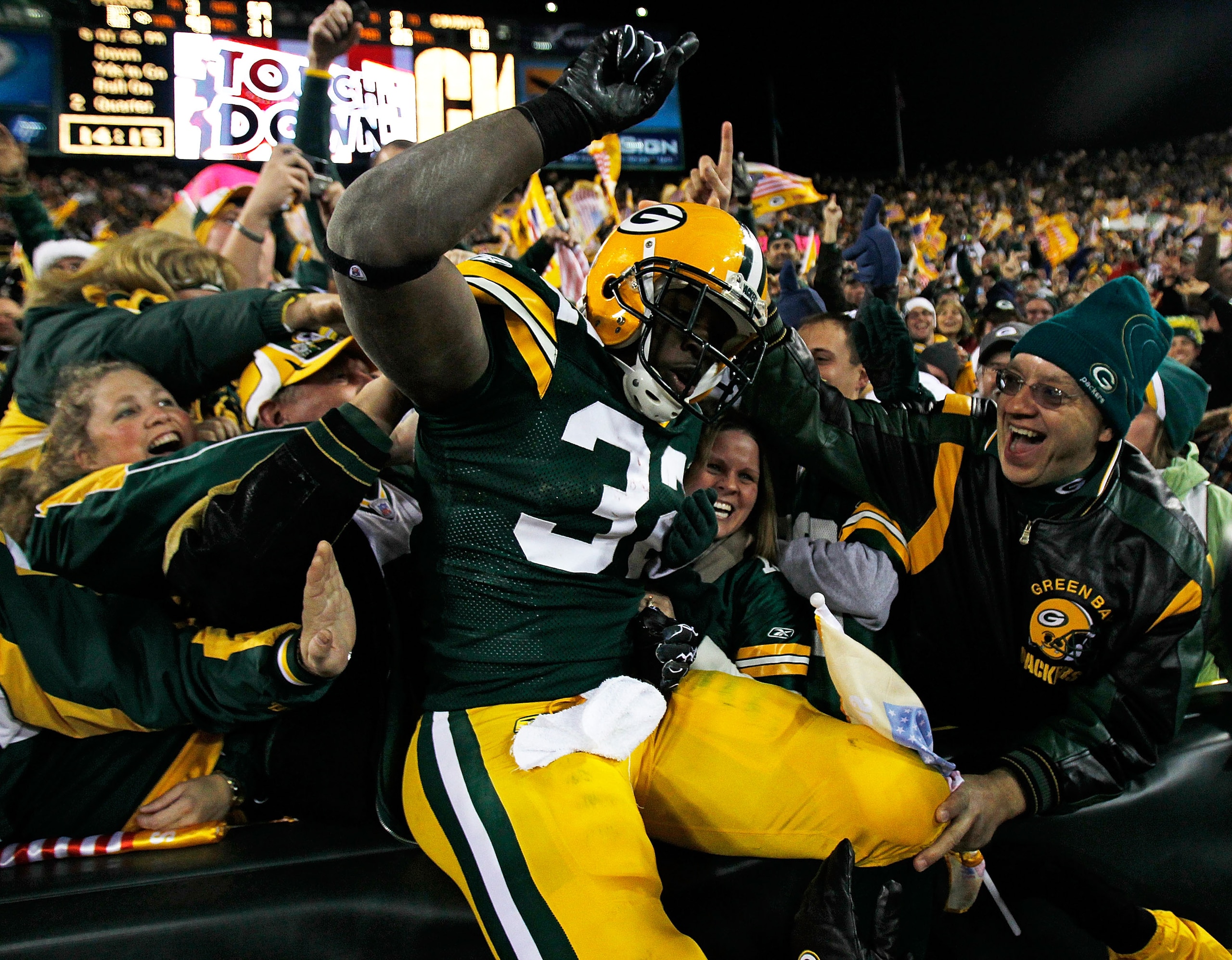 GREEN BAY, WI - NOVEMBER 07: Brandon Jackson #32 of the Green Bay Packers celebrates a touchdown with fans against the Dallas Cowboys at Lambeau Field on November 7, 2010 in Green Bay, Wisconsin. (Photo by Jonathan Daniel/Getty Images) GREEN BAY, WI - NOVEMBER 07: Brandon Jackson #32 of the Green Bay Packers celebrates a touchdown with fans against the Dallas Cowboys at Lambeau Field on November 7, 2010 in Green Bay, Wisconsin. (Photo by Jonathan Daniel/Getty Images)