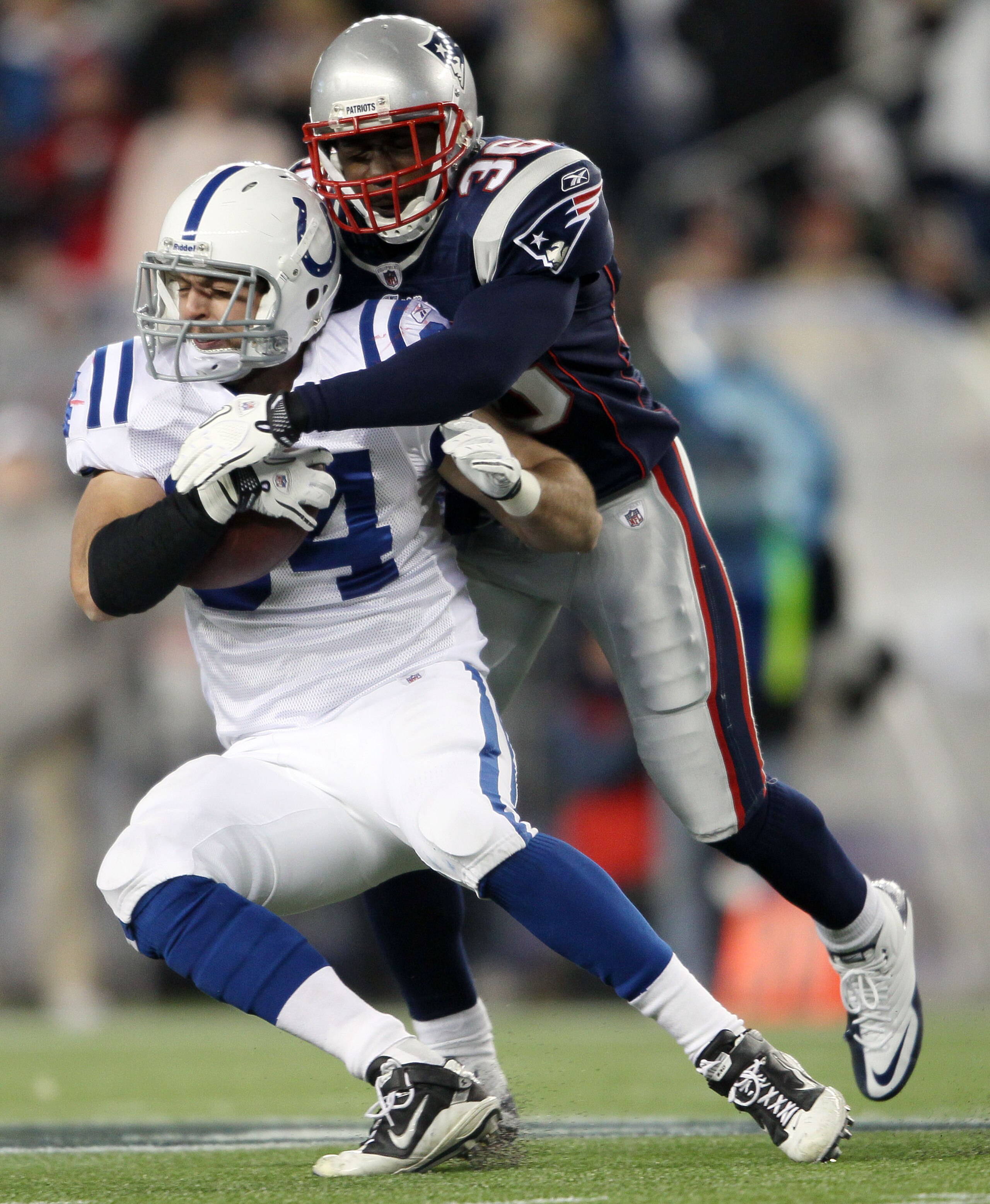 FOXBORO, MA - NOVEMBER 21:   James Sanders #36 of the New England Patriots tackles Jacob Tamme #84 of the Indianapolis Colts on November 21, 2010 at Gillette Stadium in Foxboro, Massachusetts. (Photo by Elsa/Getty Images)