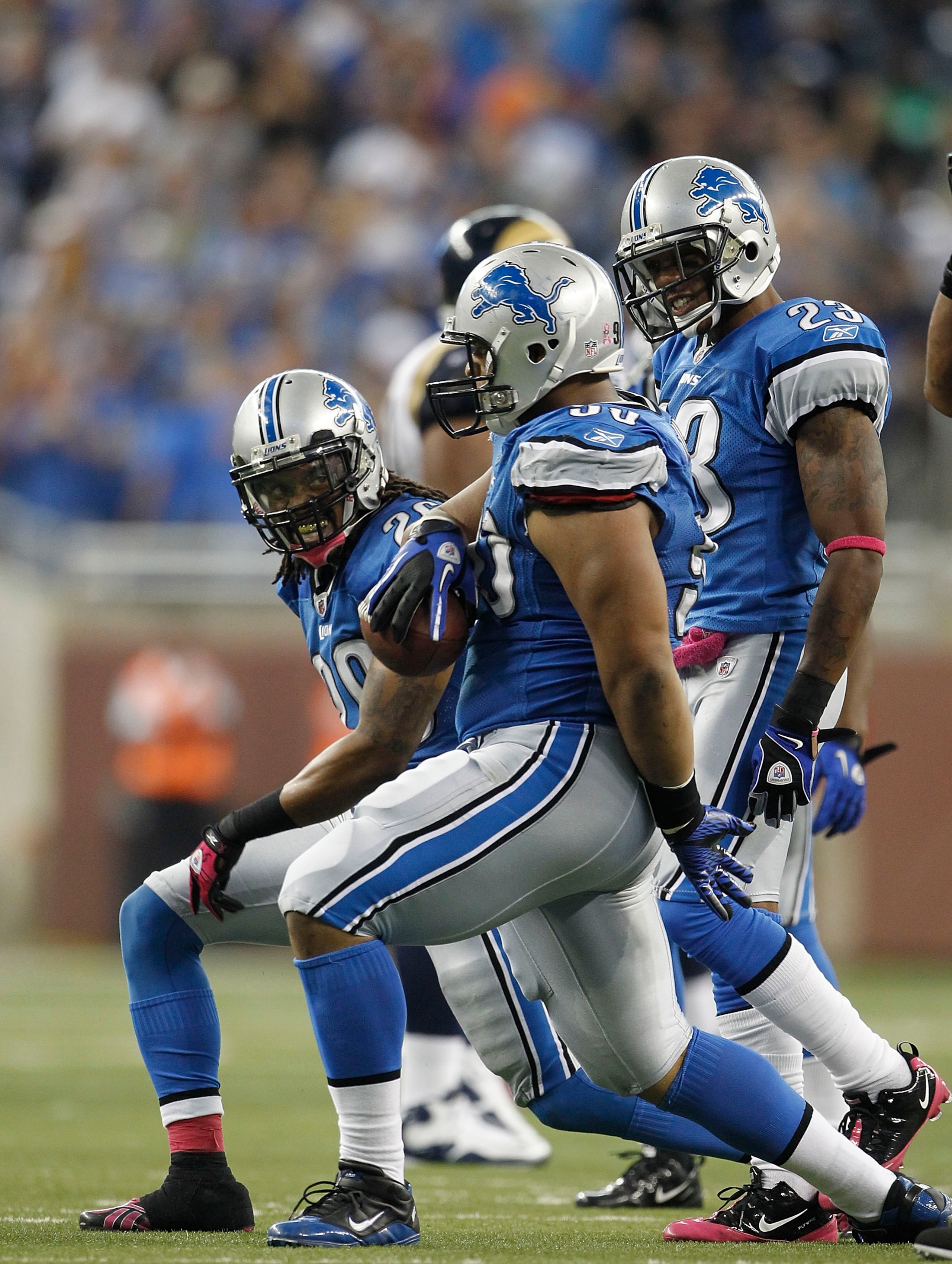DETROIT - OCTOBER 10: Louis Delmas #26 and Ndamukong Suh #90 of the Detroit Lions celebrate Suh's fourth quarter interception during the game against the St. Louis Rams at Ford Field on October 10, 2010 in Detroit, Michigan.  The Lions defeated the Rams 4