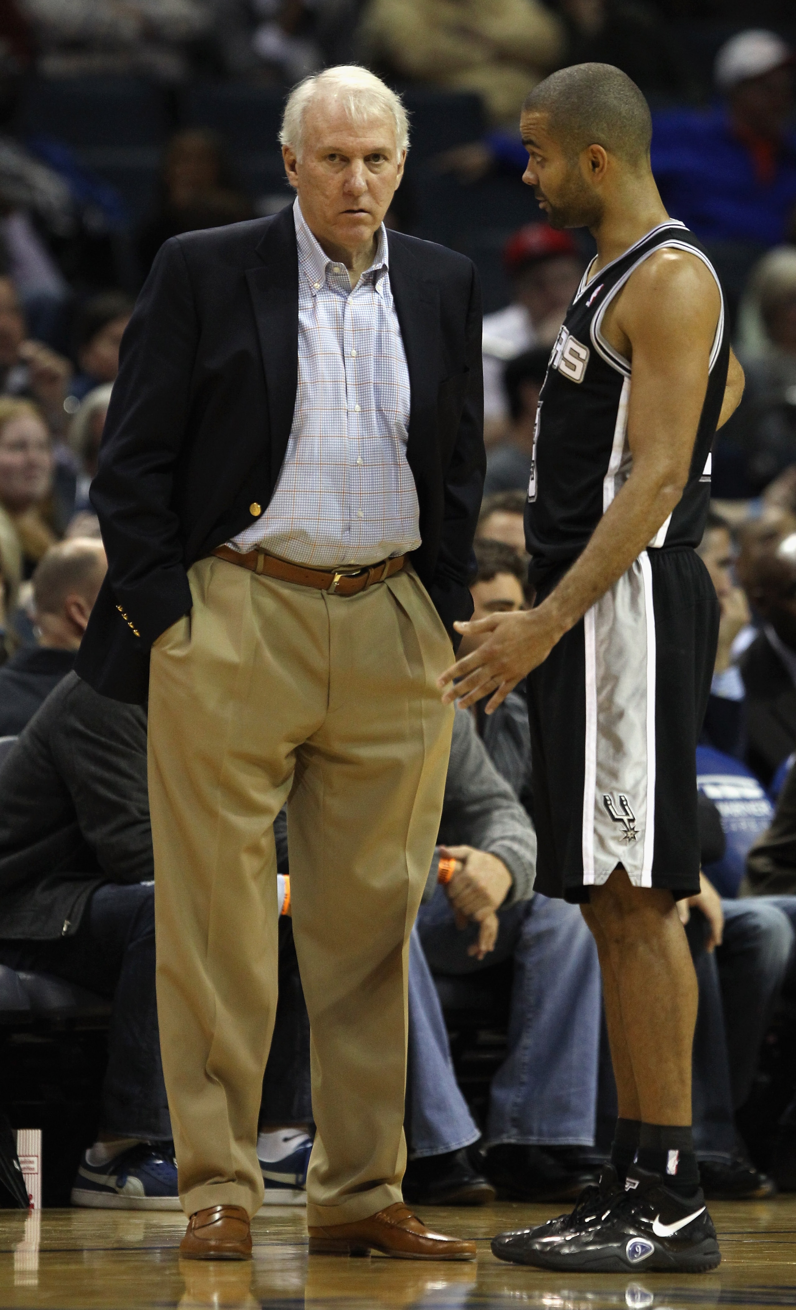 CHARLOTTE, NC - NOVEMBER 08:  Head coach Gregg Popovich and Tony Parker #9 of the San Antonio Spurs talk to eachother during their game against the Charlotte Bobcats at Time Warner Cable Arena on November 8, 2010 in Charlotte, North Carolina.  NOTE TO USE
